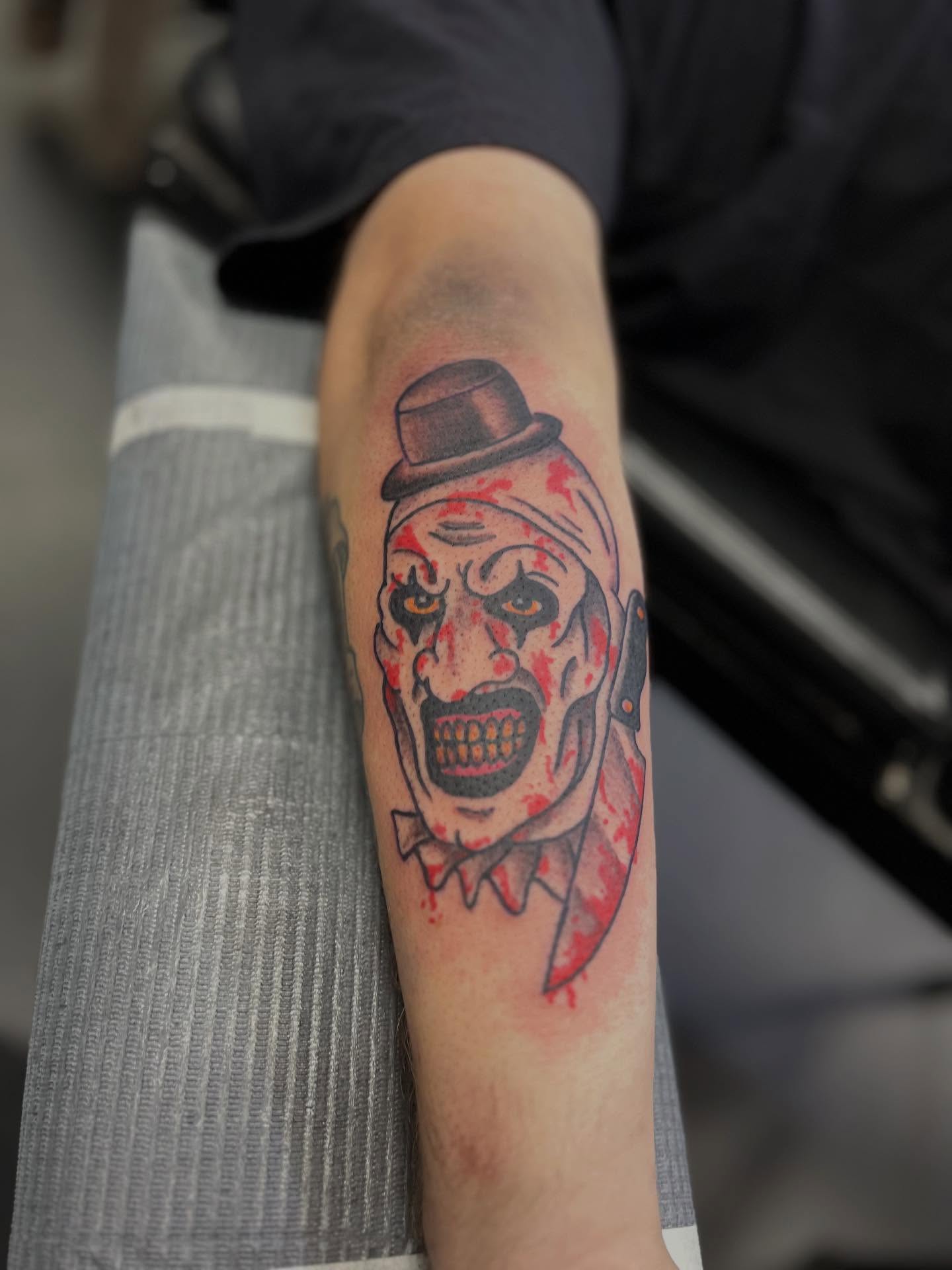 Clown dark realism tattoo on the forearm by CRAIG B⛓️ Cincinnati Tattoo Artist