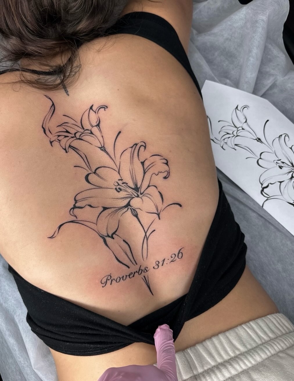 Lilies black and grey tattoo on the back by Maggie Angulo