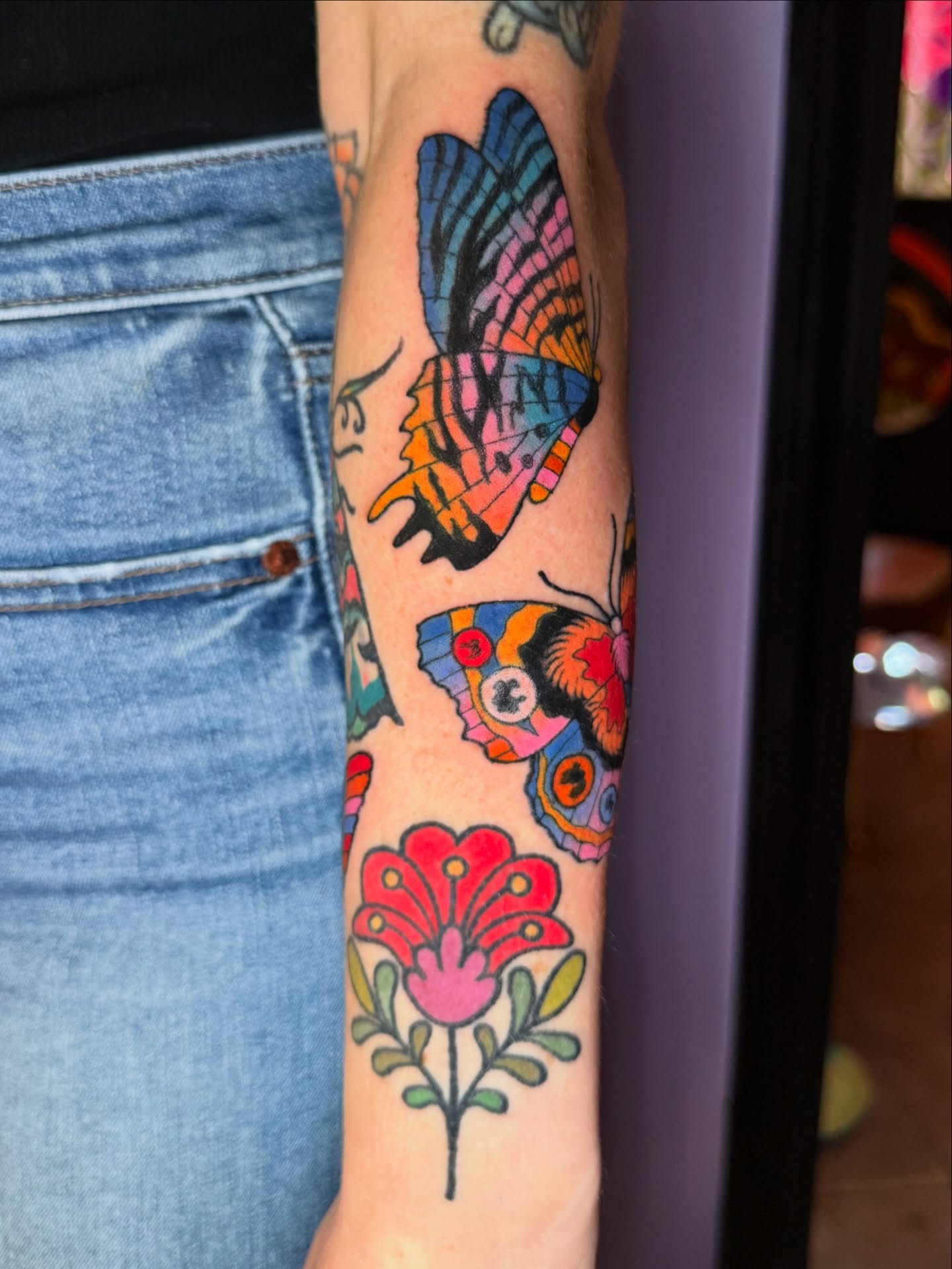 Butterflies and flower American traditional tattoo on the forearm by 🍄Annie Burkhard🍄, Indianapolis, Indiana