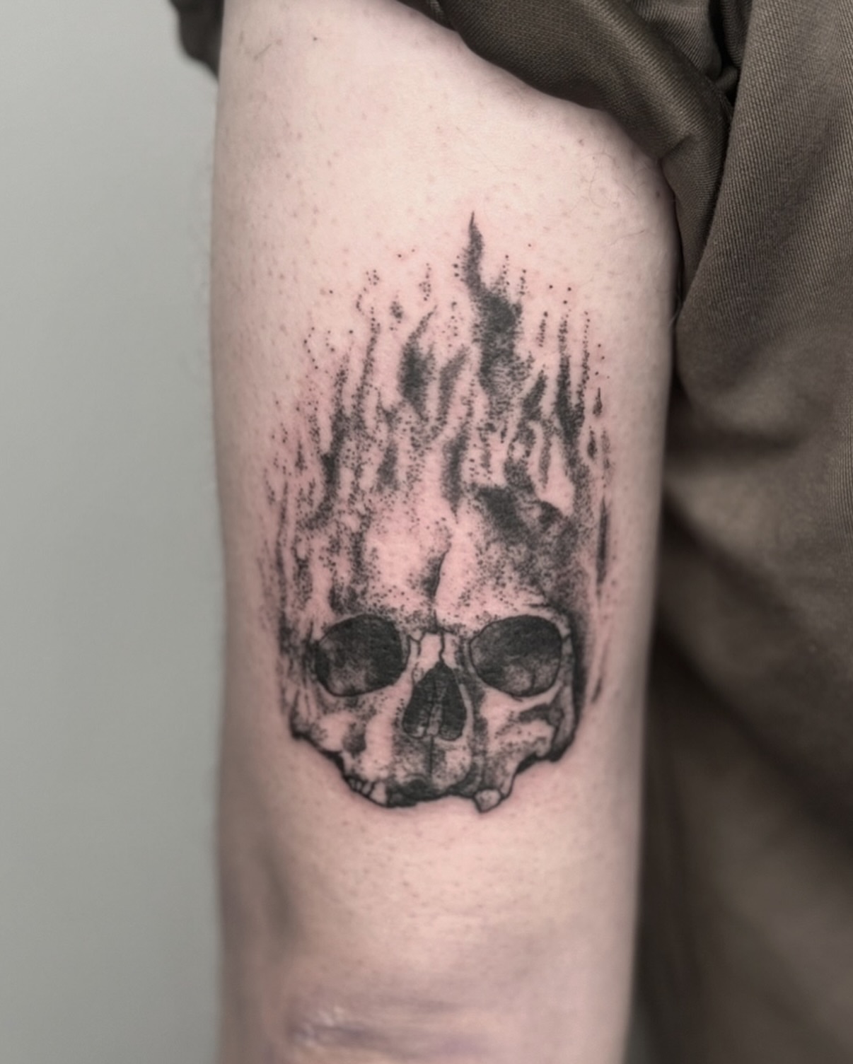 Burning skull dotwork tattoo on the forearm by Tattoo Artist, Philadelphia, Pennsylvania