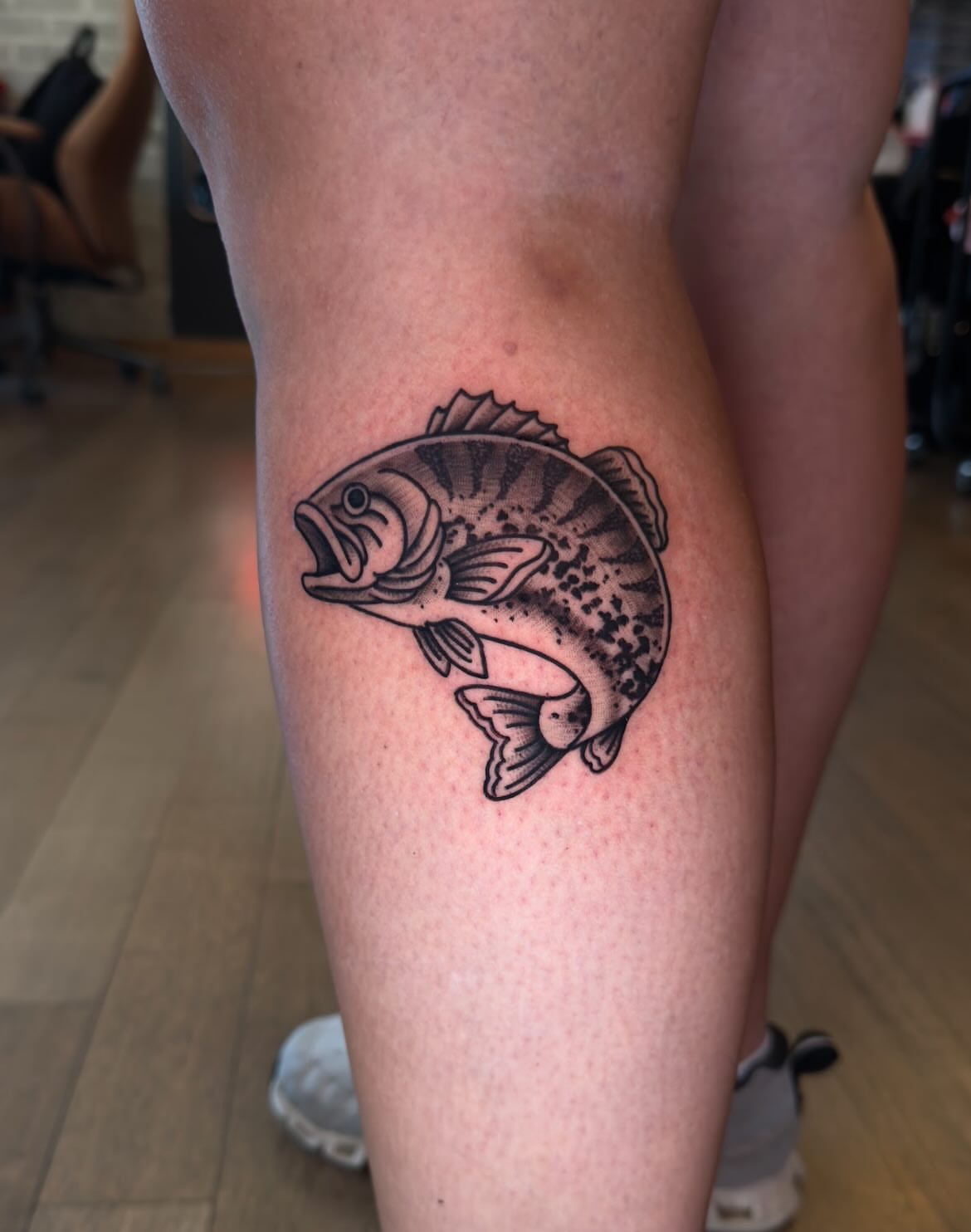 Fish black and grey tattoo on the thigh by Jessica Haug