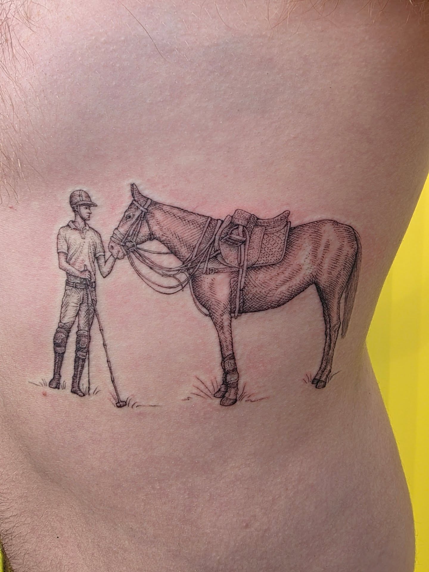 Polo player and horse realism tattoo on the ribs by Keith Countryman, Fort Worth, Texas