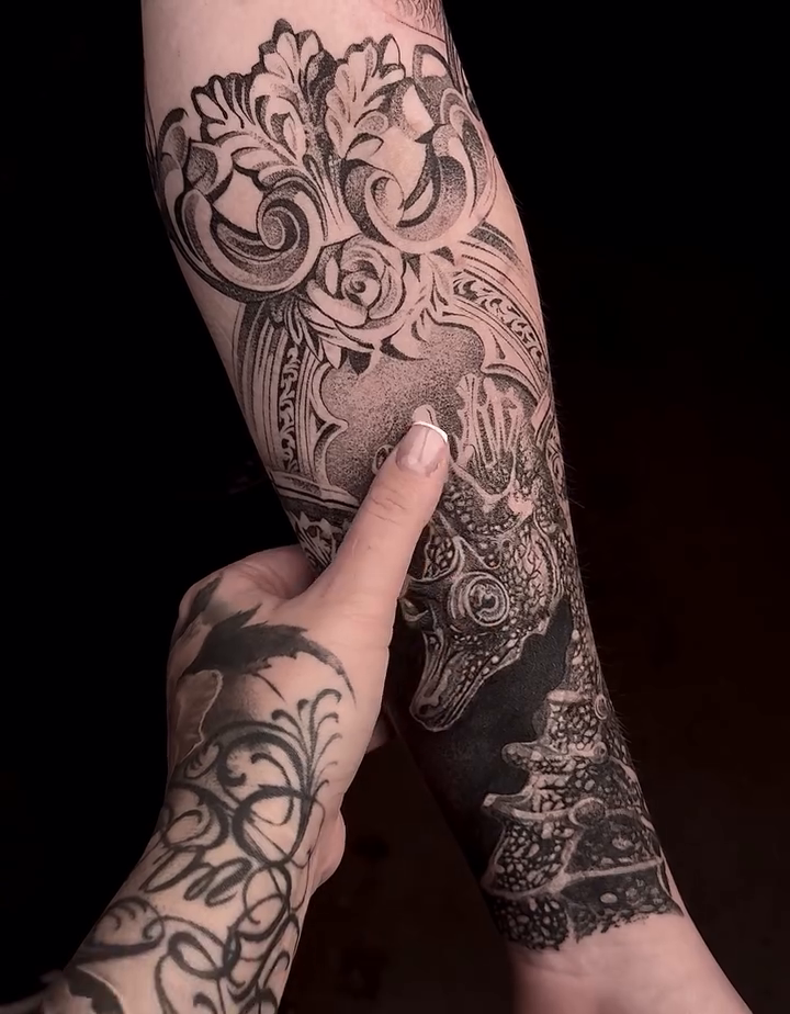 Ornate dragon and floral sleeve ornamental tattoo on the forearm by sacramento tattoo CA