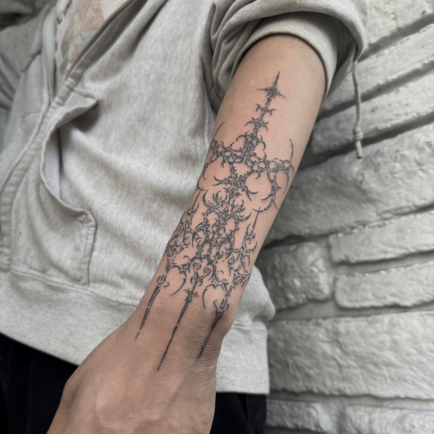 Thorn crown black and grey tattoo on the forearm by Cybersigilism & Fineline Blackwork