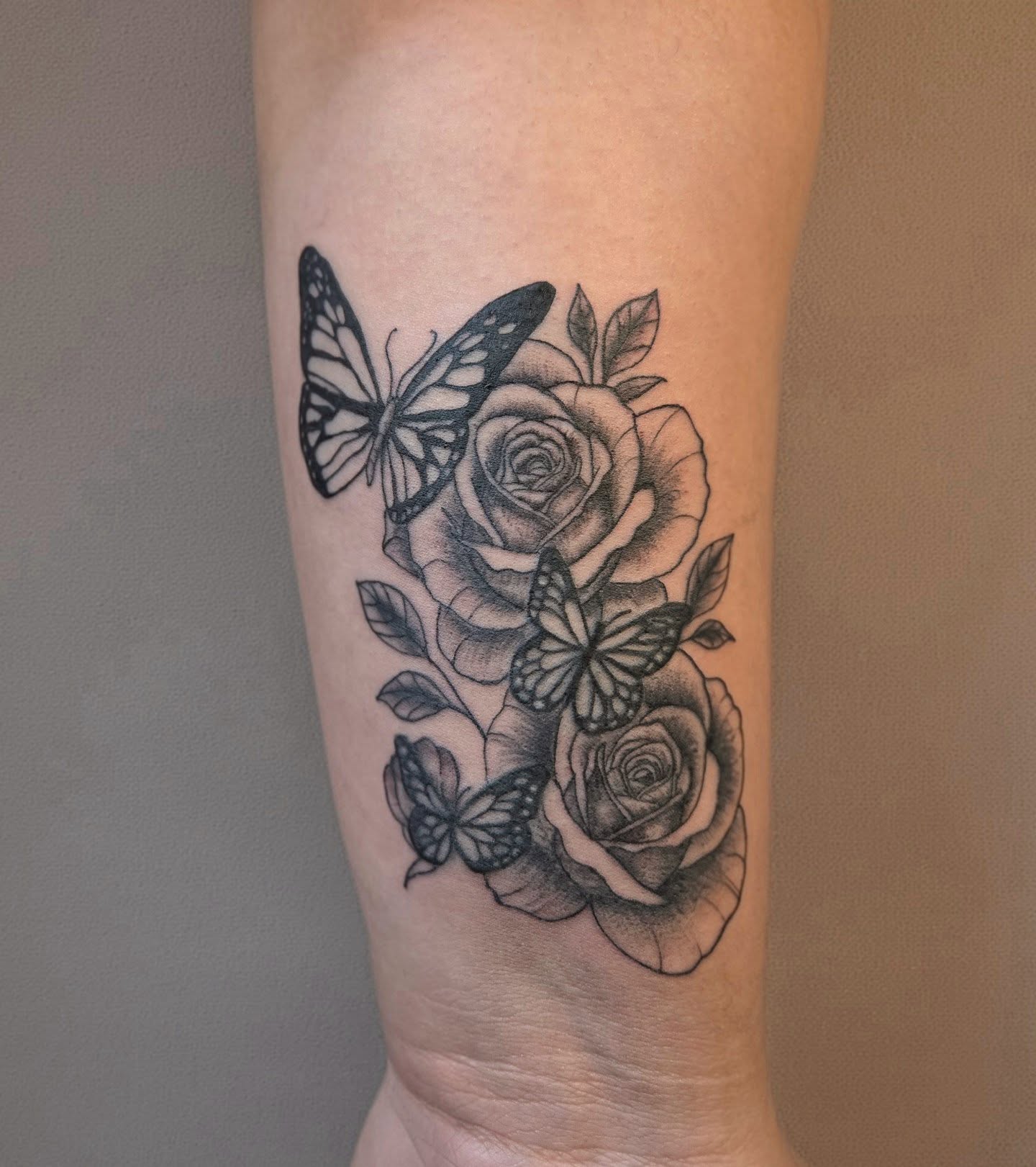 Roses and butterflies realism tattoo on the forearm by Jose G. Rubio Tattoo Artist πΊπ²ππ¨π¦