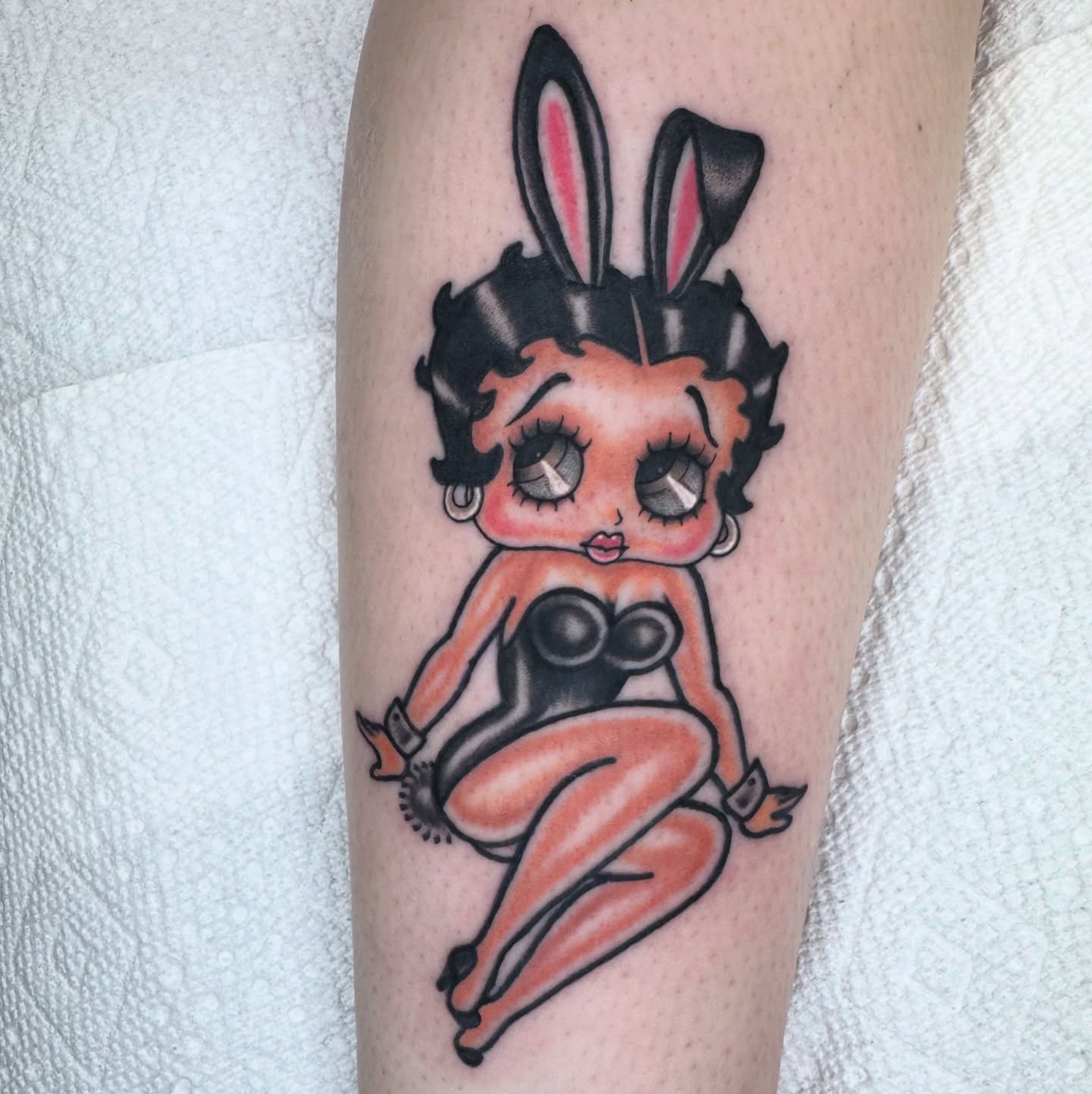 Betty Boop American traditional tattoo on the forearm by Lisa Del Toro