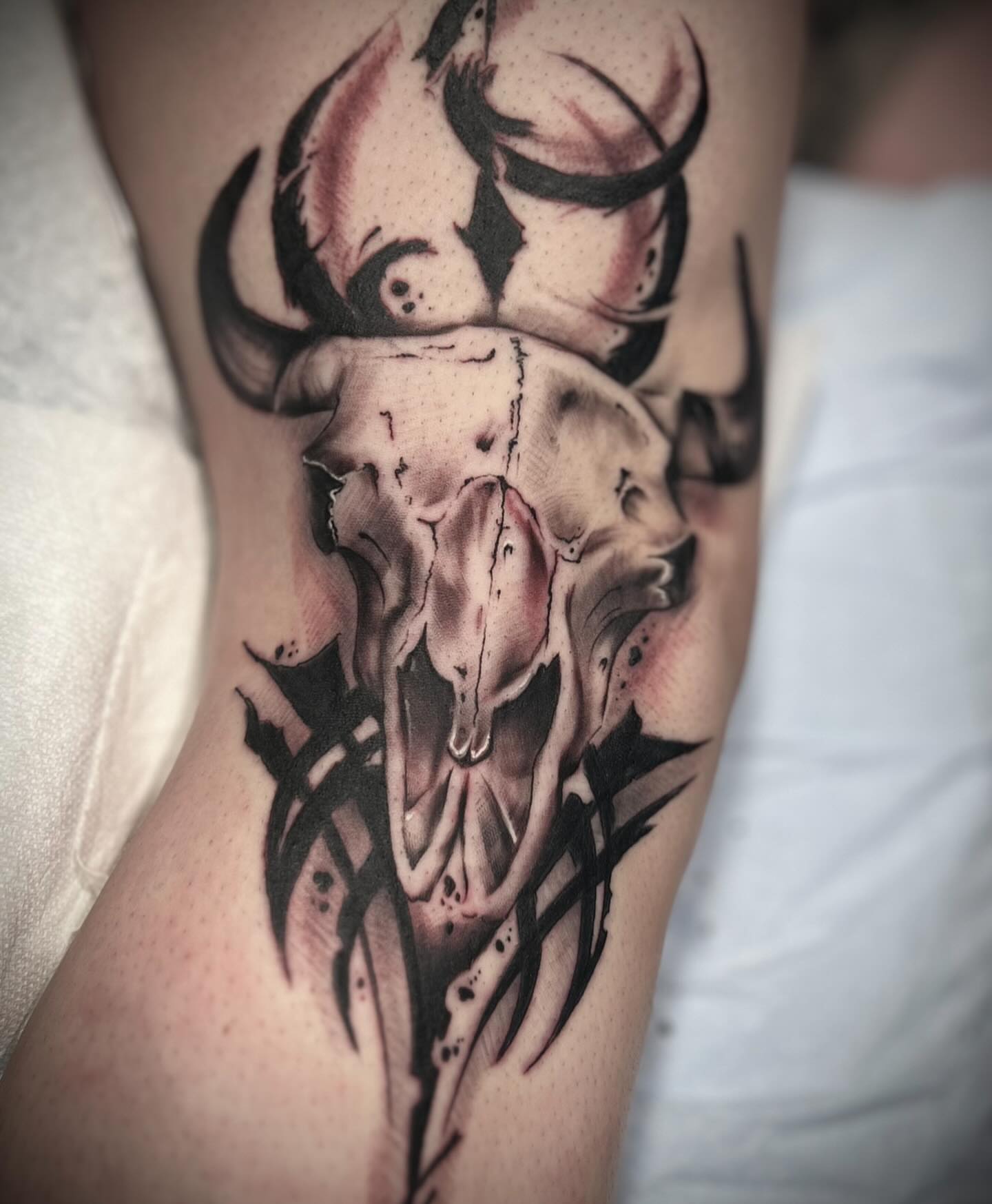 Bull skull realism tattoo on the forearm by Matthew Crawley