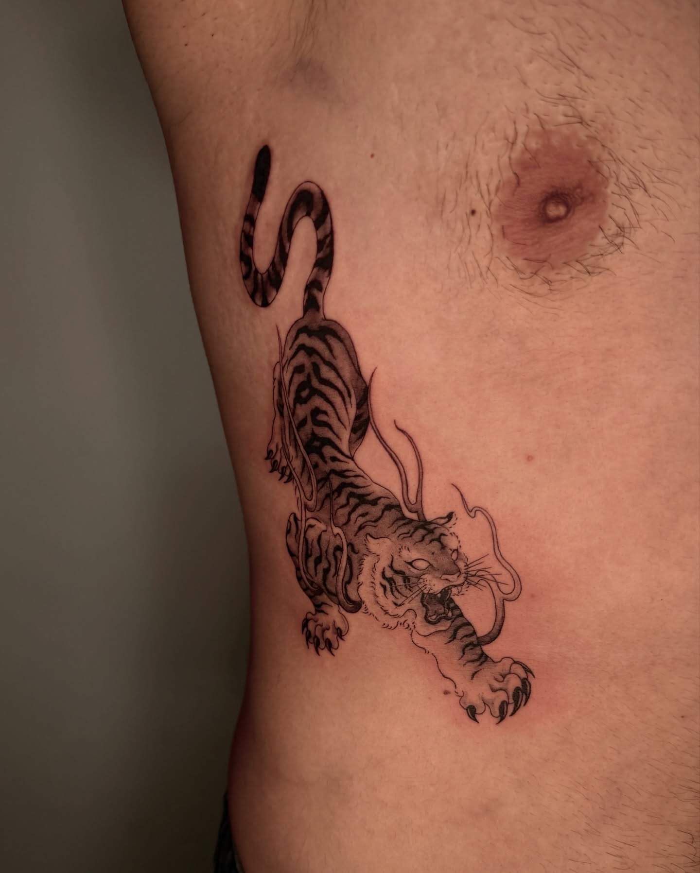Tiger black and grey tattoo on the thigh by Sab