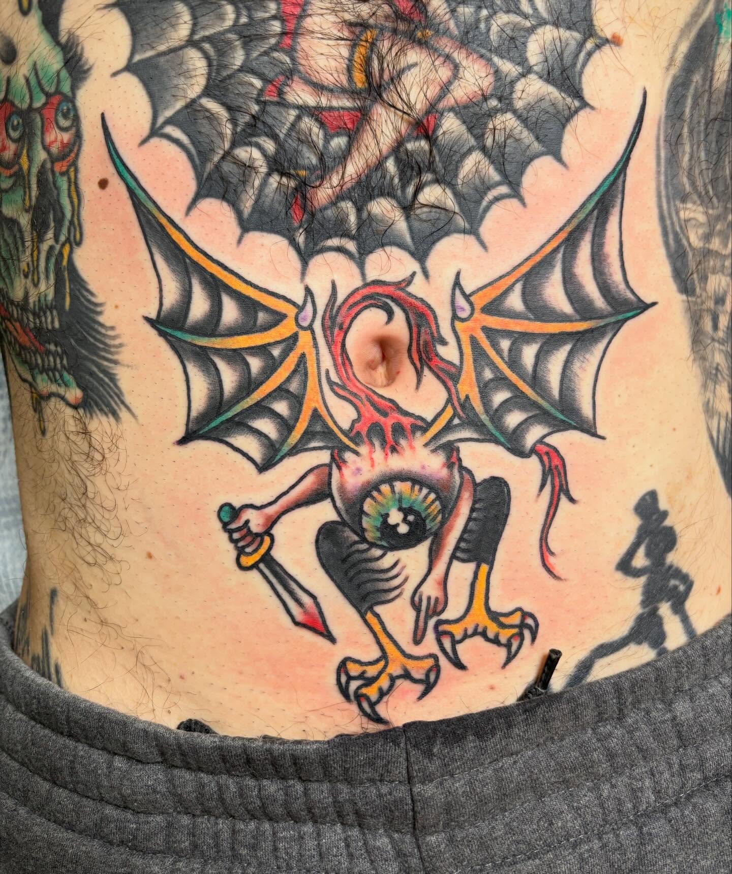 Demon with sword American traditional tattoo on the torso by Steve Reid