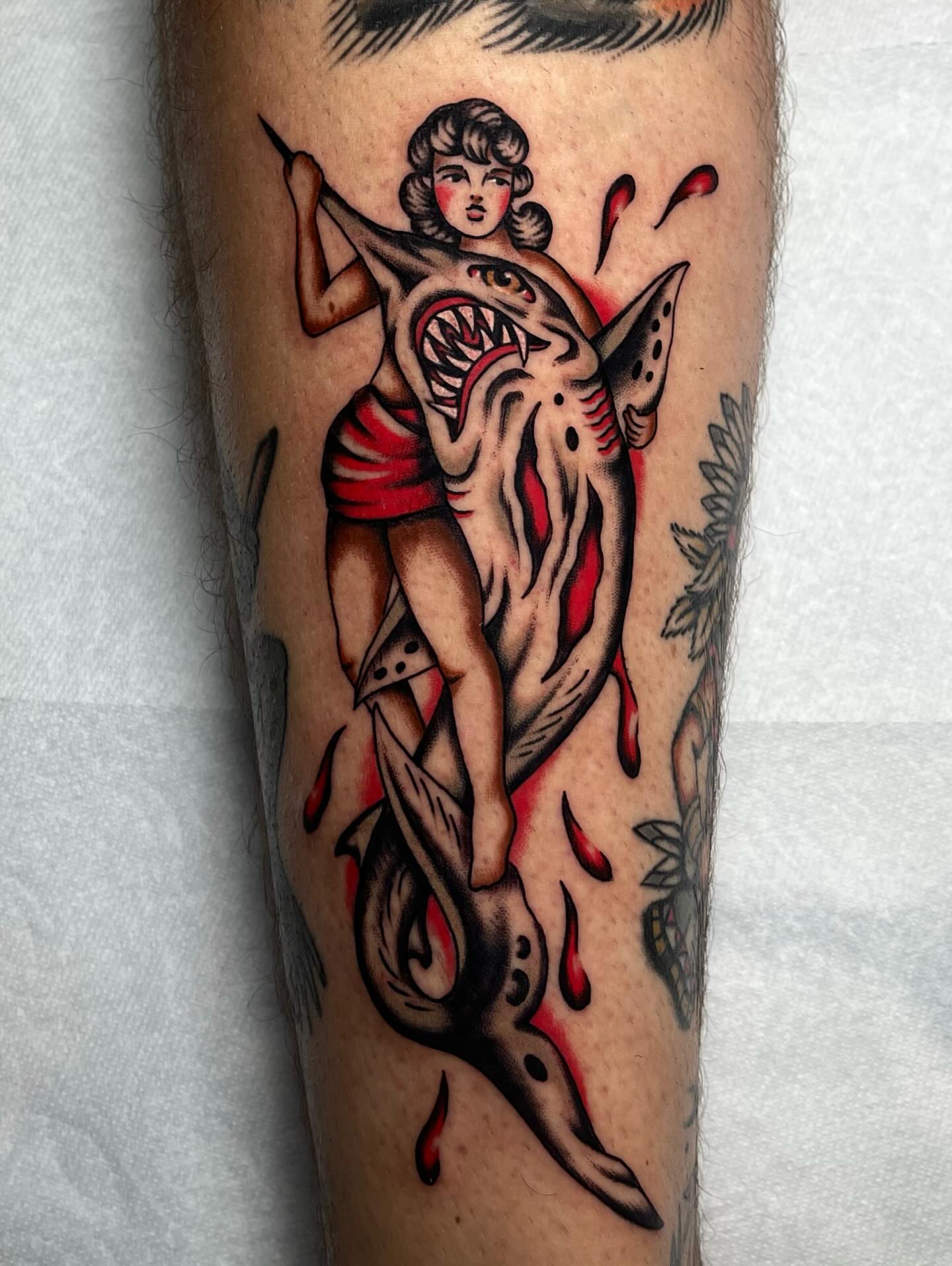 Woman riding shark American traditional tattoo on the forearm by Casey Sullivan, San Diego, California
