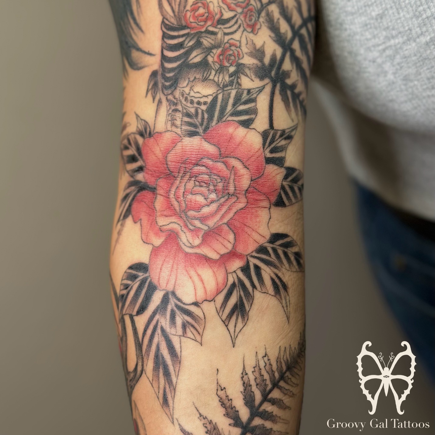 Rose American traditional tattoo on the forearm by Groovy P