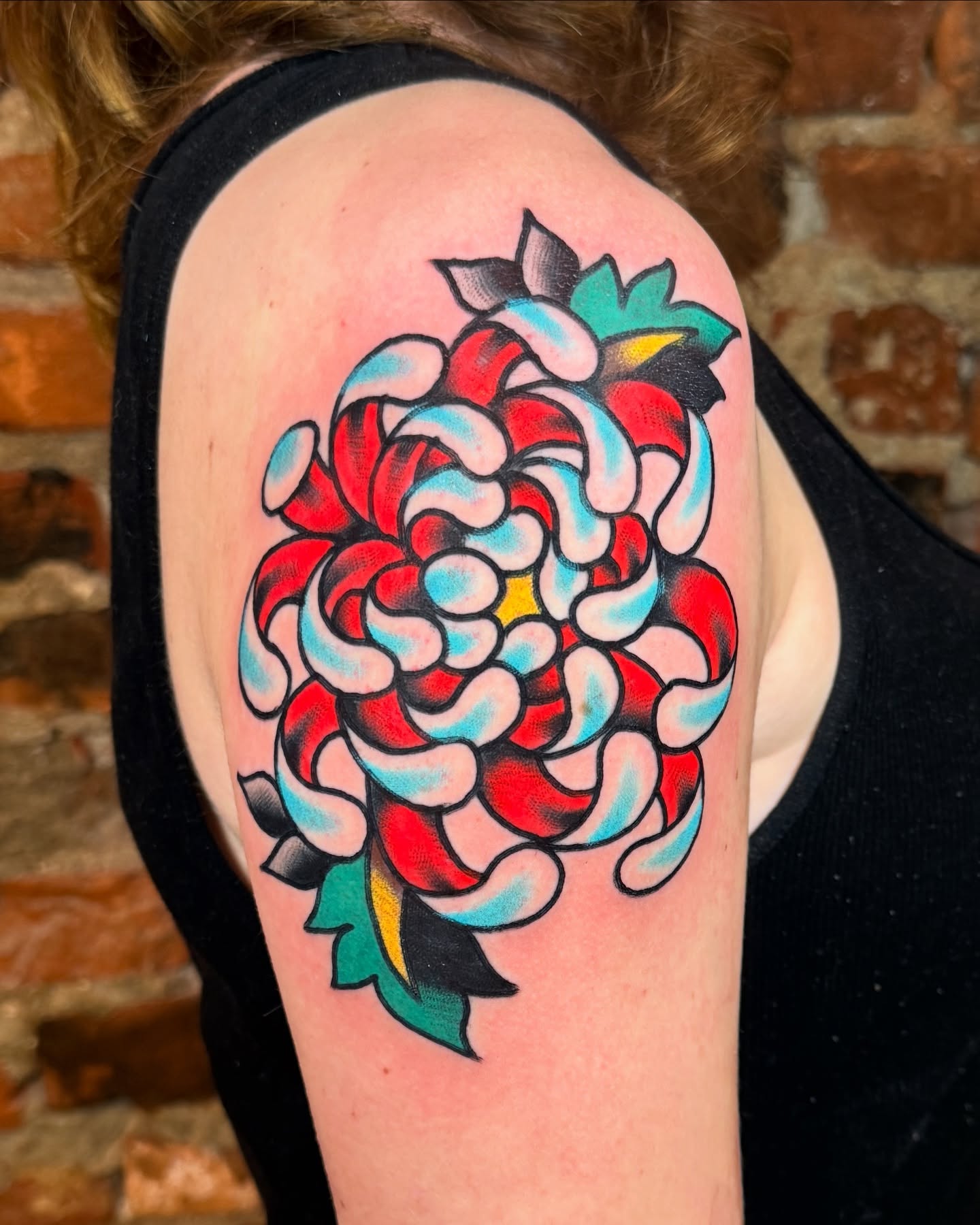 Chrysanthemum American traditional tattoo on the shoulder by Cullen Bleser Quinn