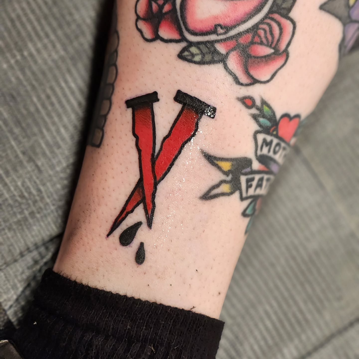 Letter 'V' American traditional tattoo on the forearm by Sonya ๐ฟ๐ธ๐พ