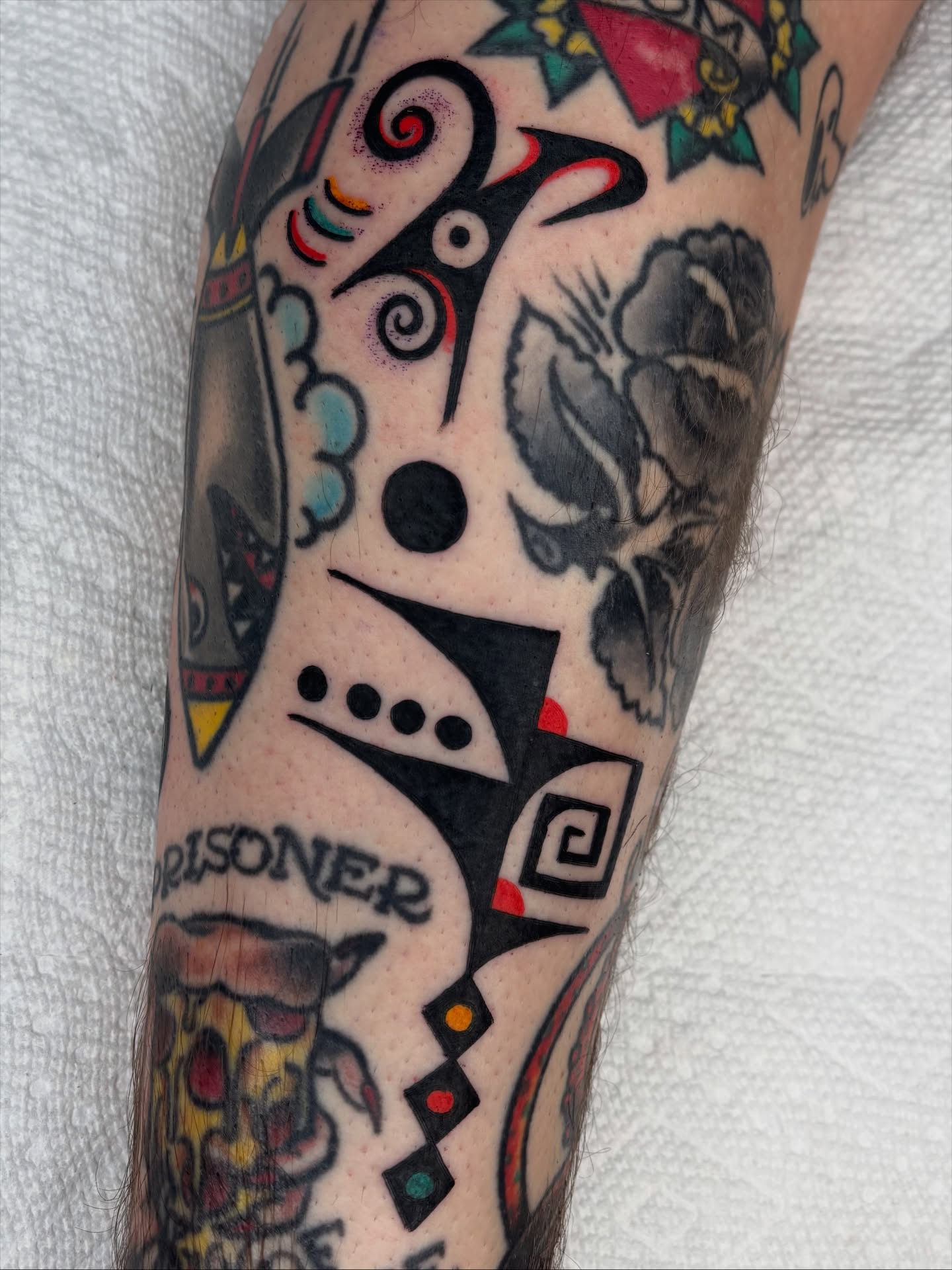 Pizza slice American traditional tattoo on the forearm by Charlie Dunkel Tattoo