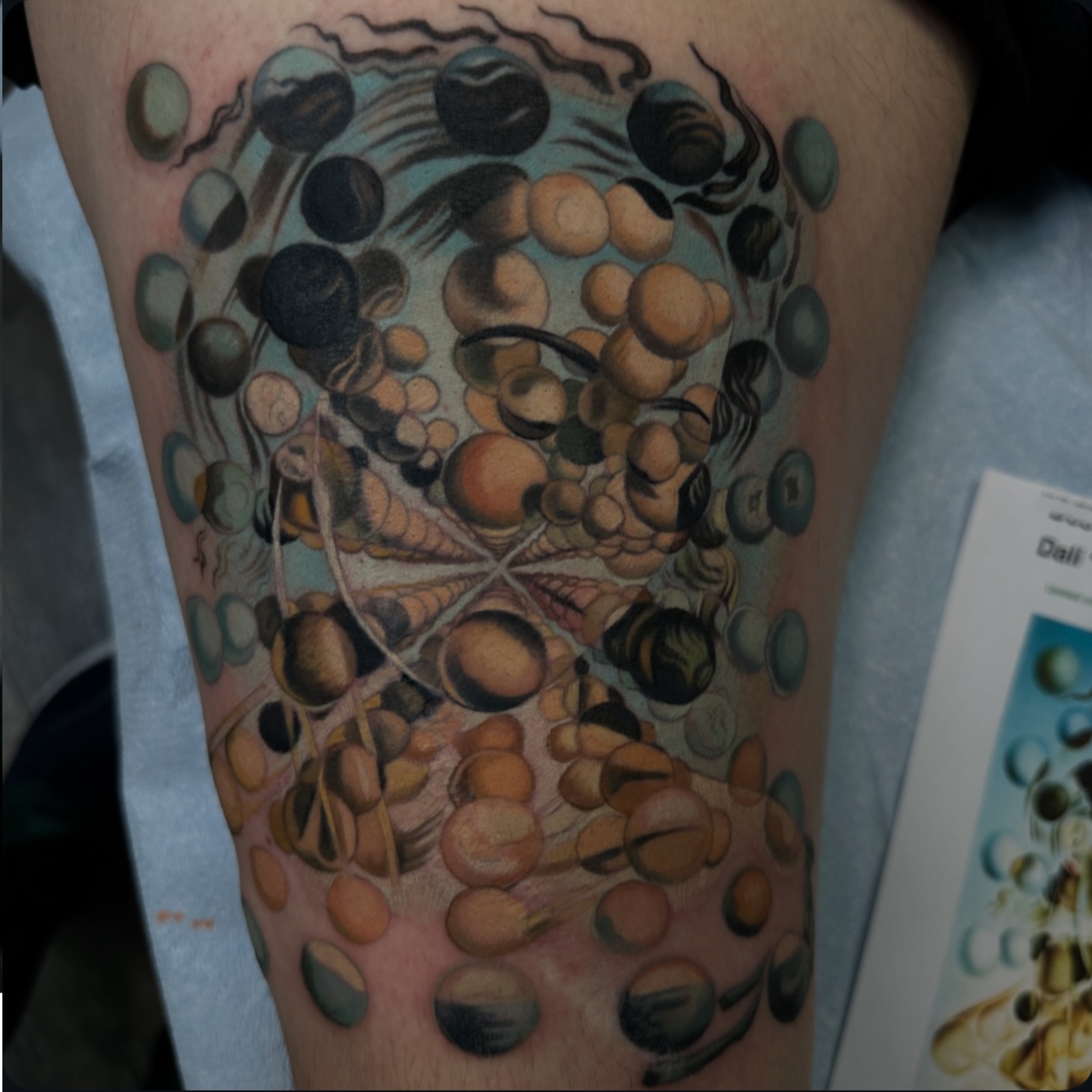 DNA strand realism tattoo on the thigh by John Tarrao, Berwyn, Pennsylvania
