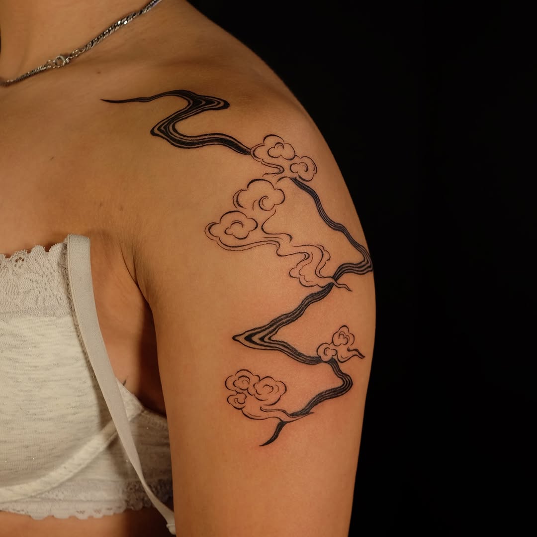 Clouds and flowing lines cyber sigilism tattoo on the shoulder by lela