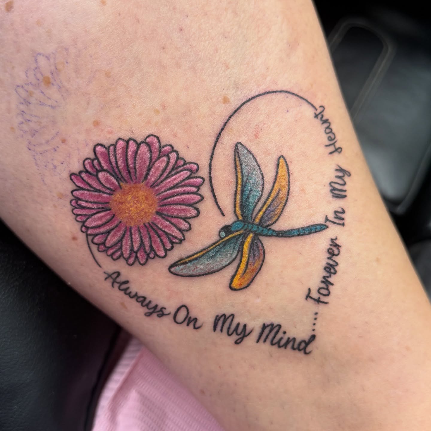 Flower and dragonfly dotwork tattoo on the forearm by Eva, Matawan, New Jersey
