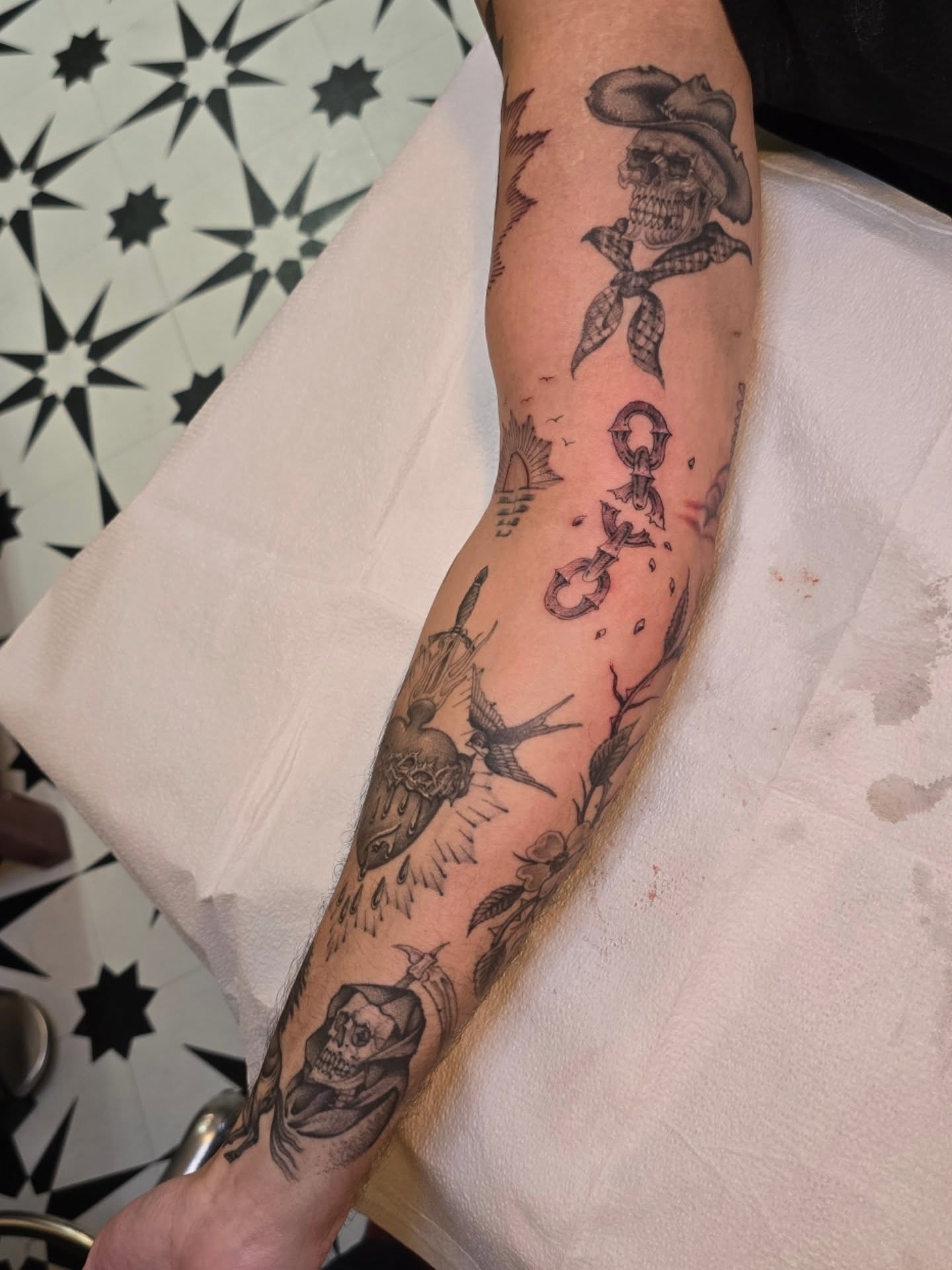 Skull and bandana American traditional tattoo on the forearm by Aaron Dor