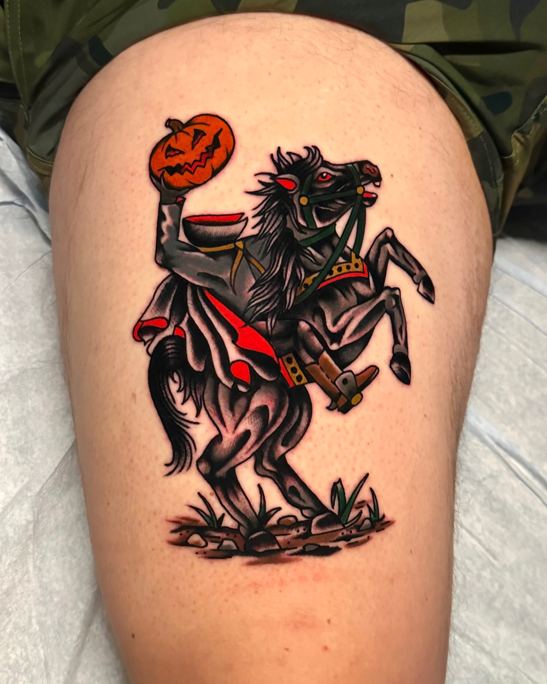 Horseman with pumpkin American traditional tattoo on the thigh by Tony Perez- Austin Texas Tattooer