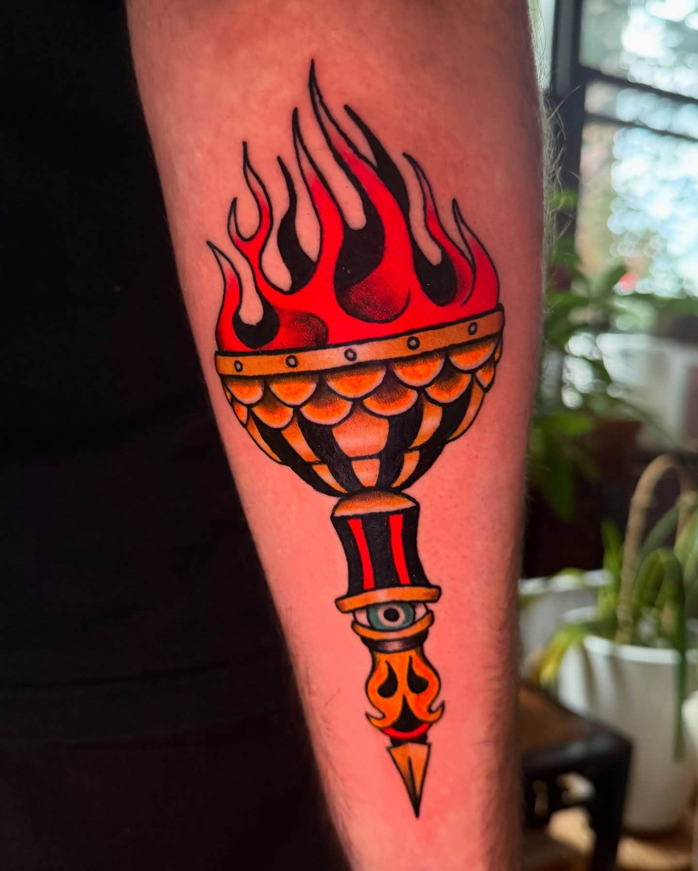 Flame-topped torch American traditional tattoo on the forearm by marlena borscheid