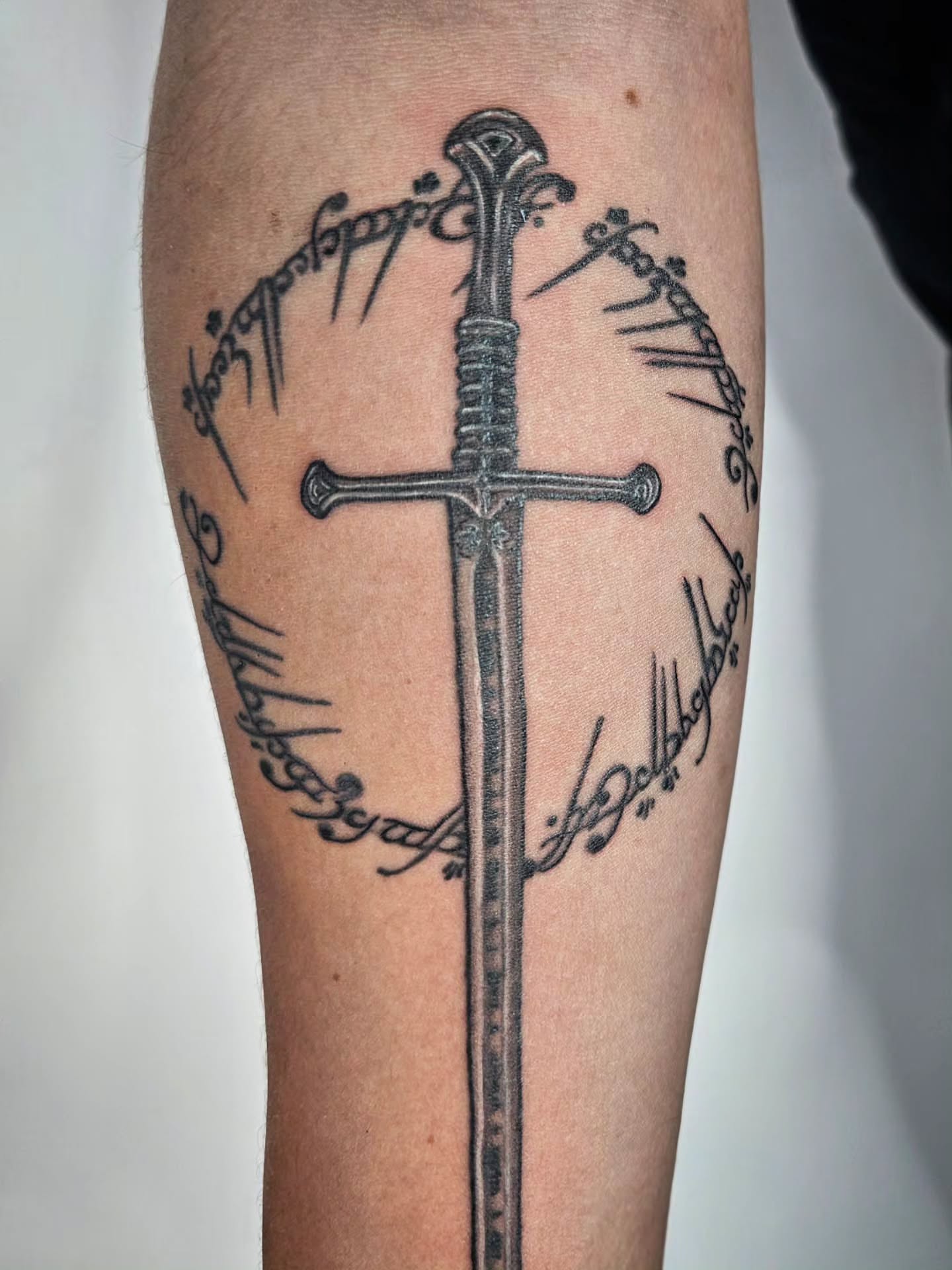 Sword black and grey tattoo on the forearm by J. Arturo Laparra
