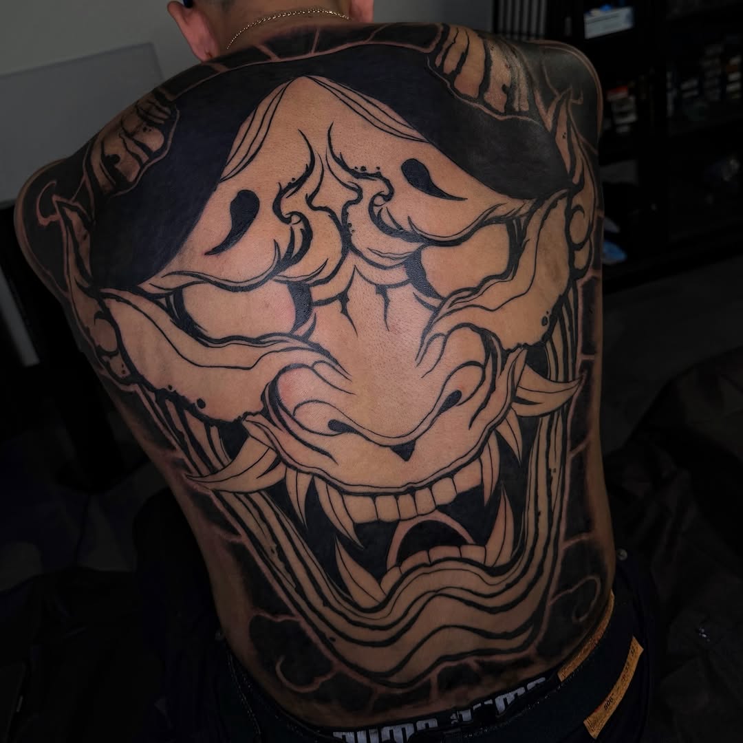 Oni mask Japanese tattoo on the back by Melissa "Lotuss" Chan