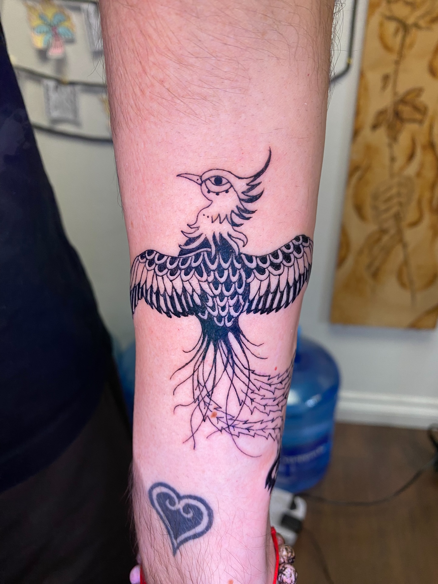 Bird black and grey tattoo on the forearm by Melissa Contreras