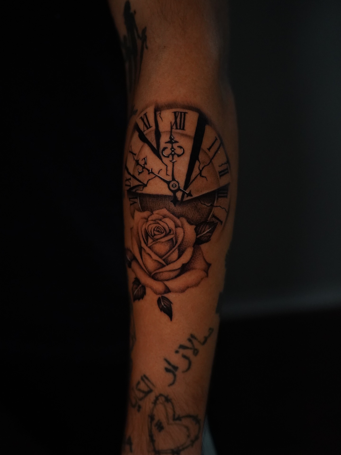 Clock and rose realism tattoo on the forearm by Dallas Tattoo Artist
