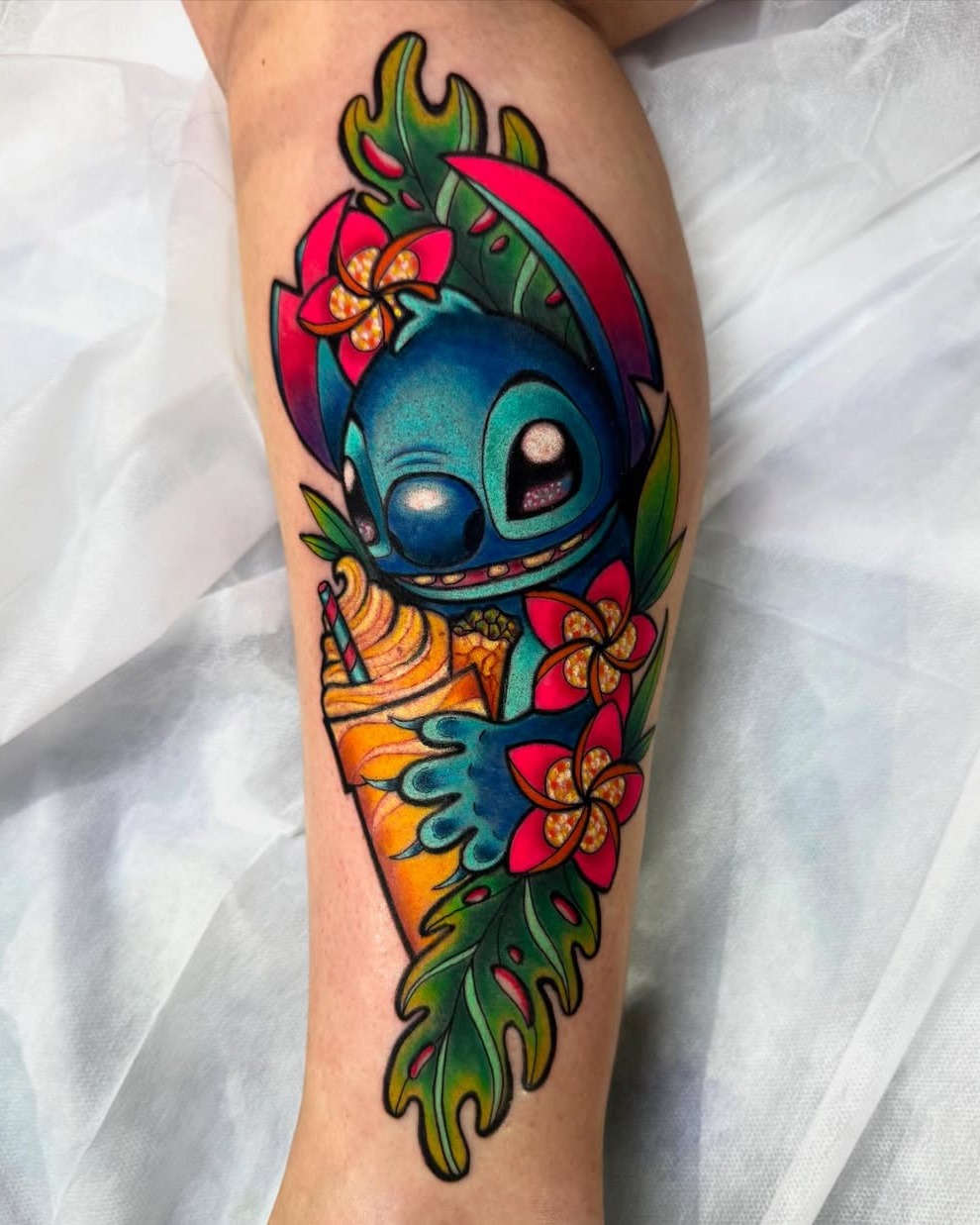 Lilo & Stitch new school tattoo on the forearm by Bailey Drey