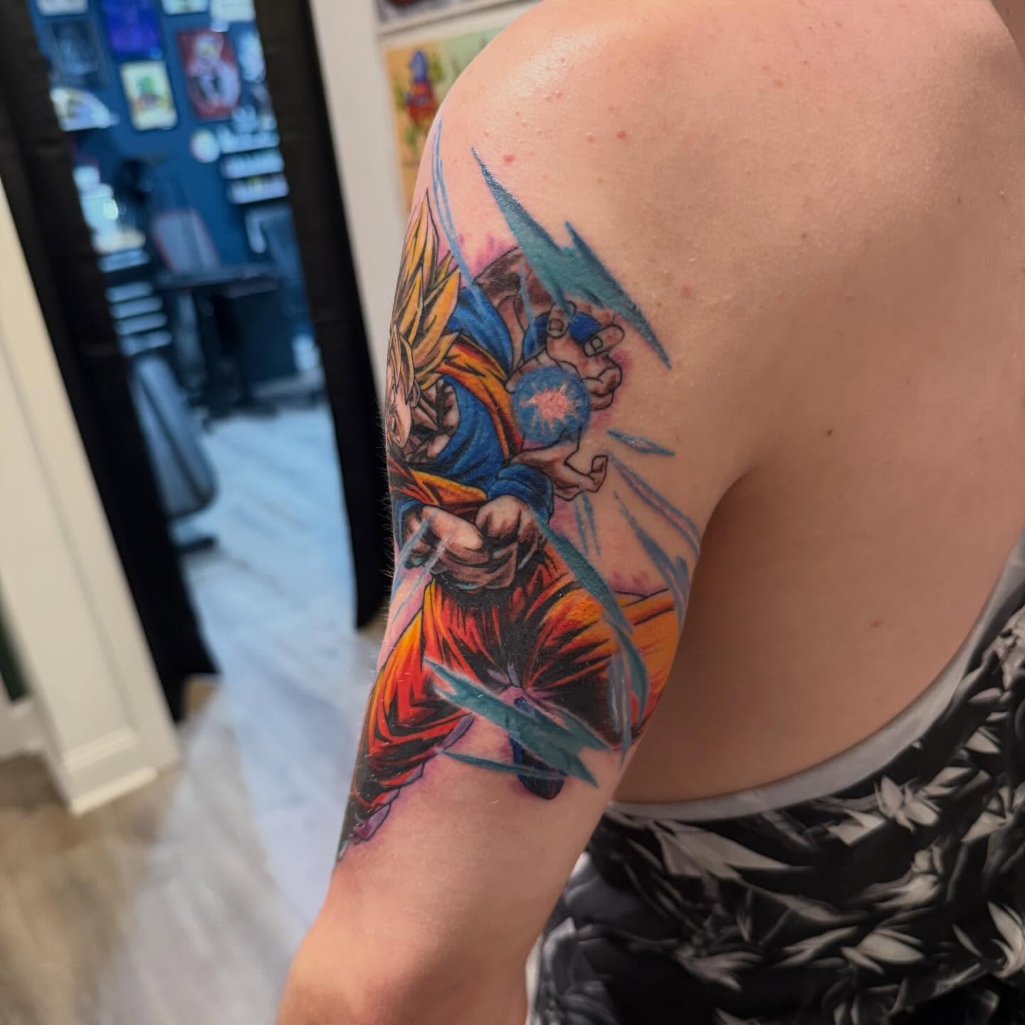 Dragon ball z character anime tattoo on the upper arm by Matthew Gordon
