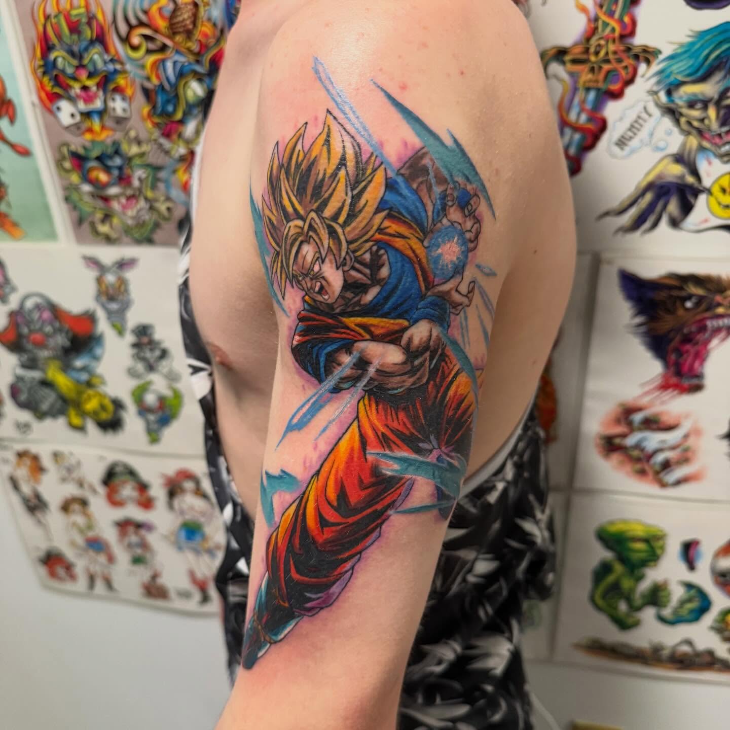 Dragon ball z character anime tattoo on the upper arm by Matthew Gordon