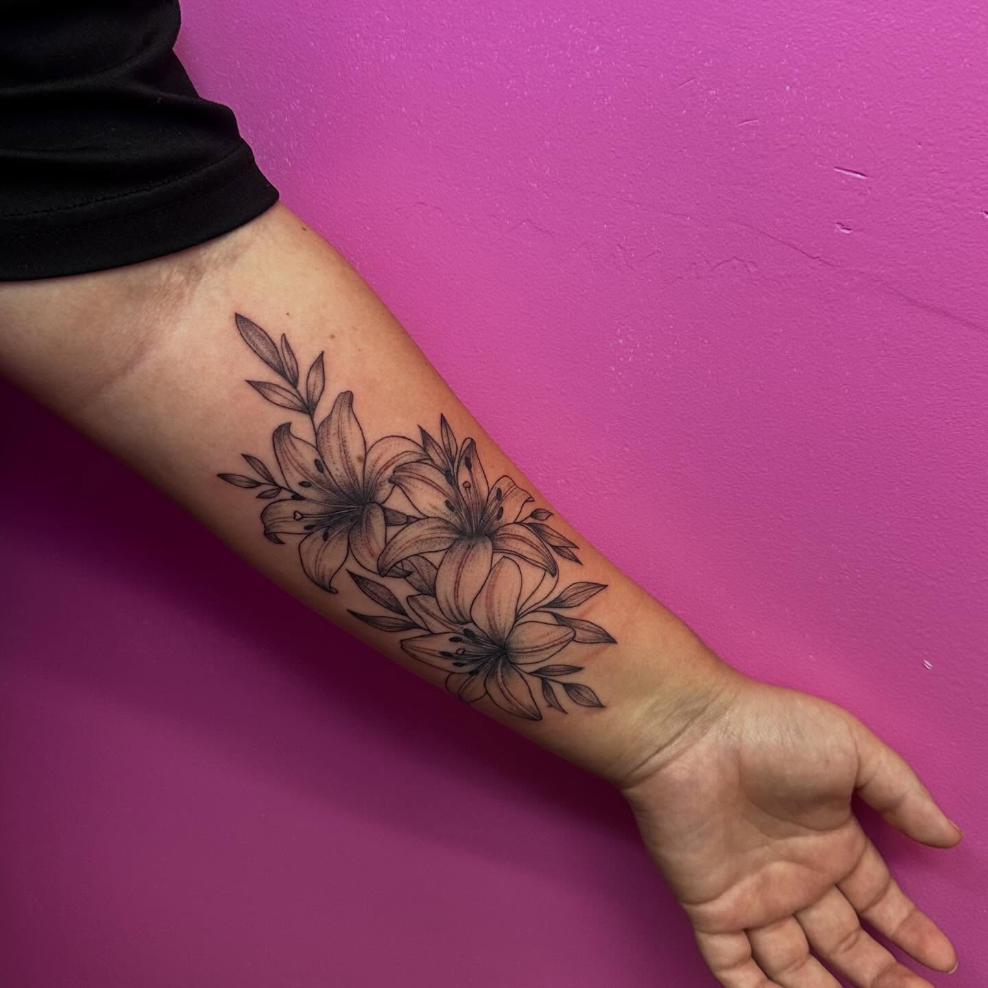 Lilies black and grey tattoo on the forearm by Vegas Tattoo Mommy ๐๐, Las Vegas, Nevada