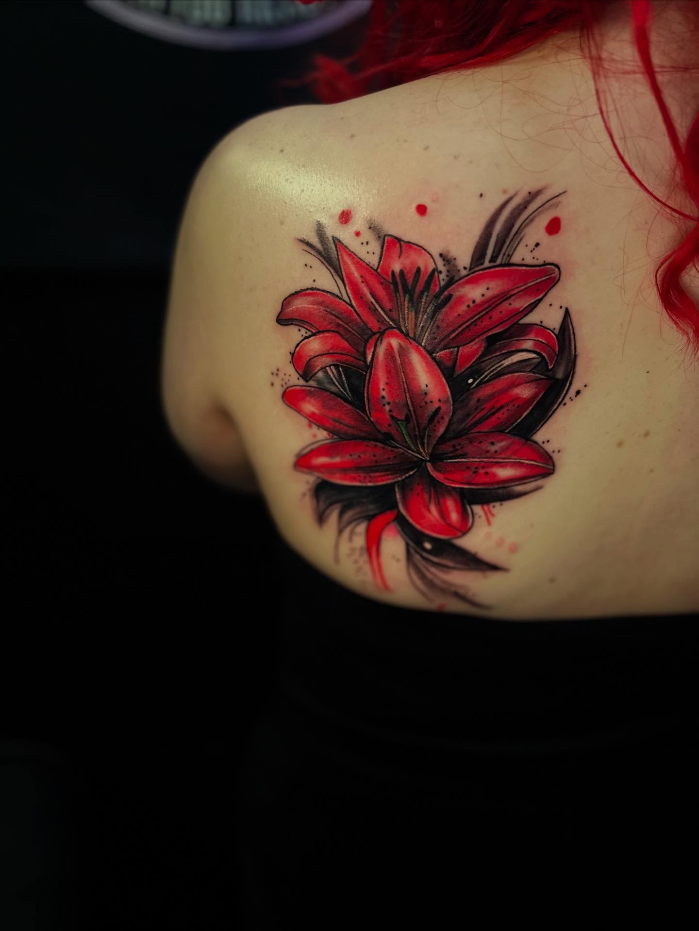 Red lily dotwork tattoo on the shoulder by Aj Negrete Jr.