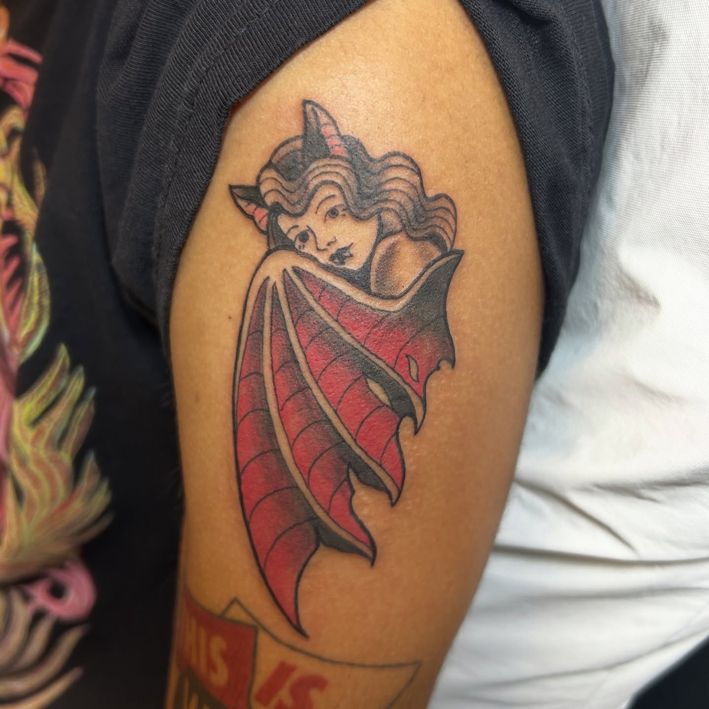 Devil American traditional tattoo on the shoulder by Mickey
