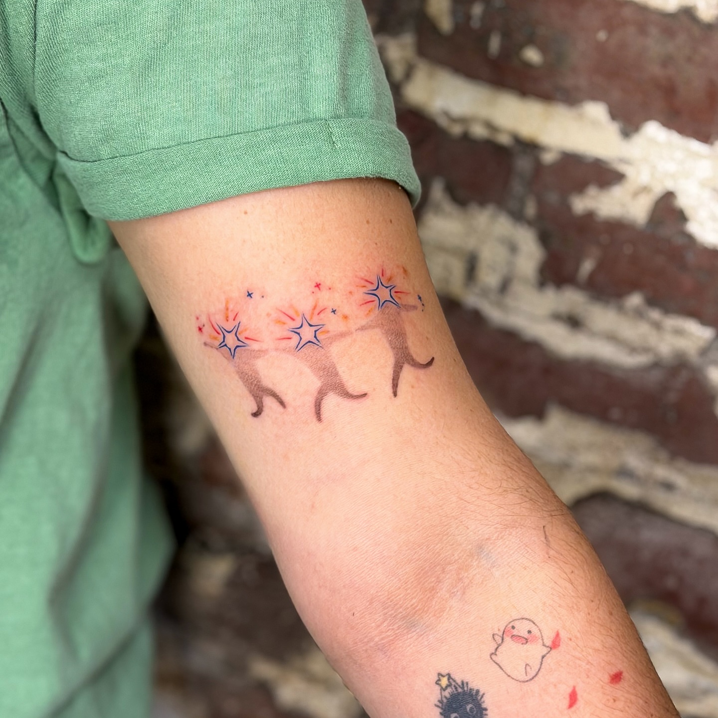Deer and stars watercolor tattoo on the forearm by justin