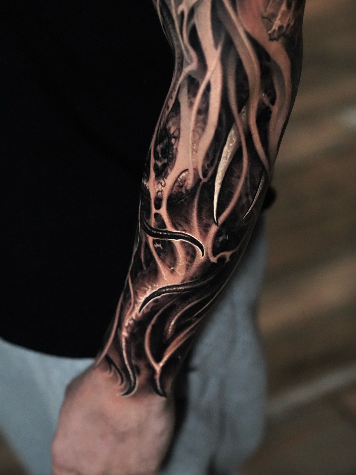 Flame geometric tattoo on the forearm by Victor Portugal Tattoo