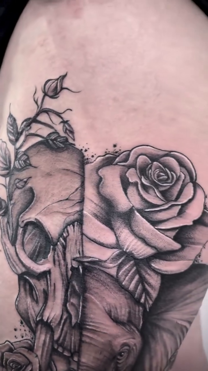Elephant, skull, and roses realism tattoo by Tattoo Ottawa