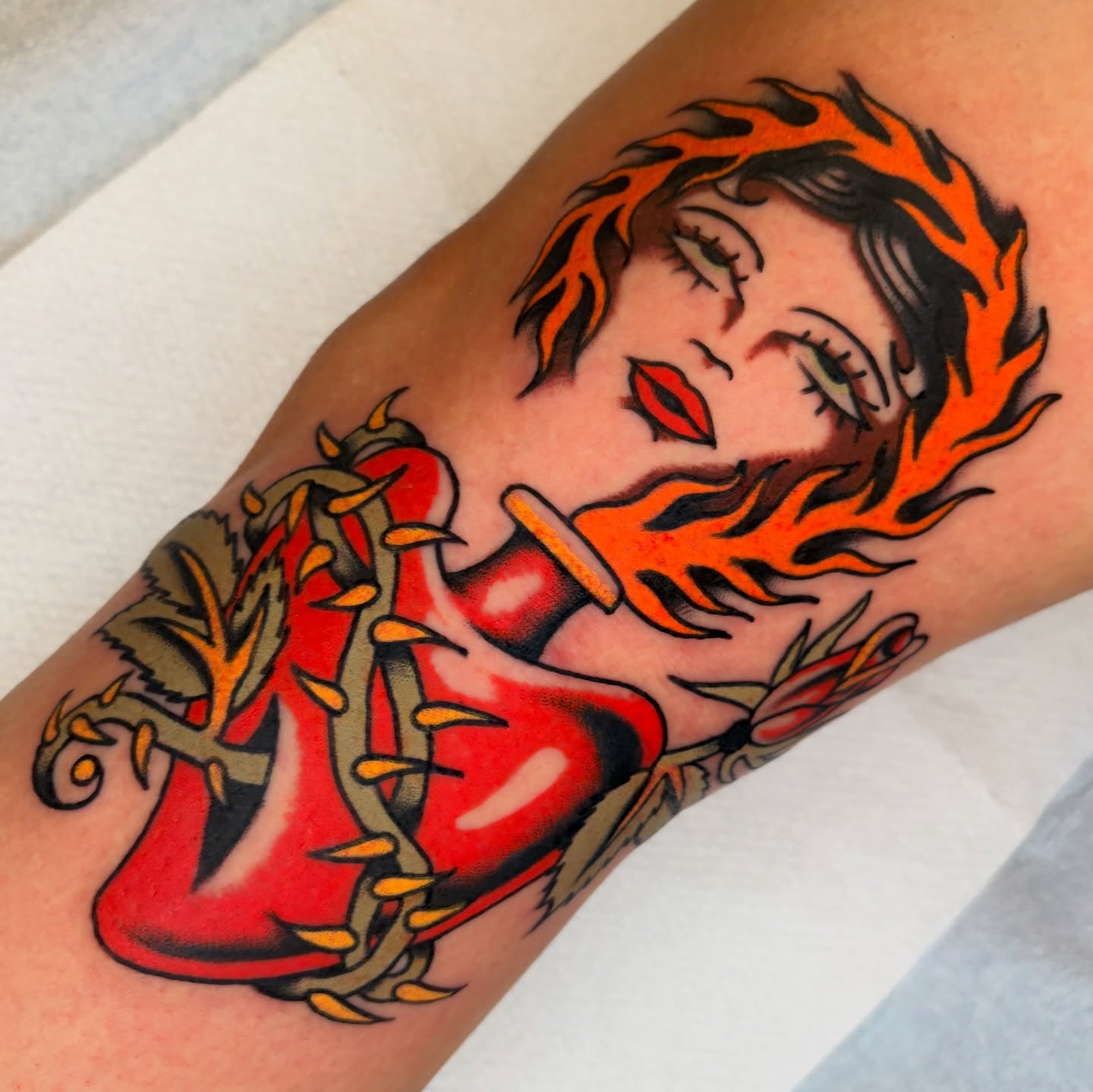 Flaming woman American traditional tattoo on the forearm by rachael