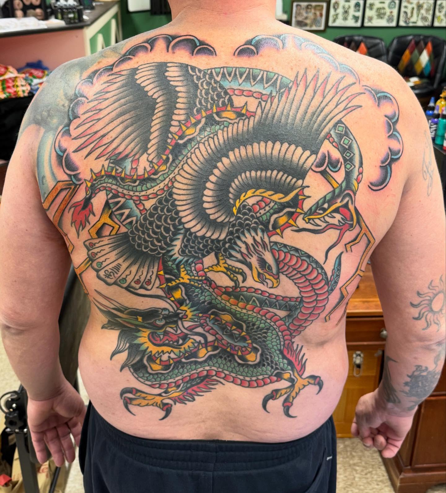 Dragon American traditional tattoo on the back by Jesse Coldiron