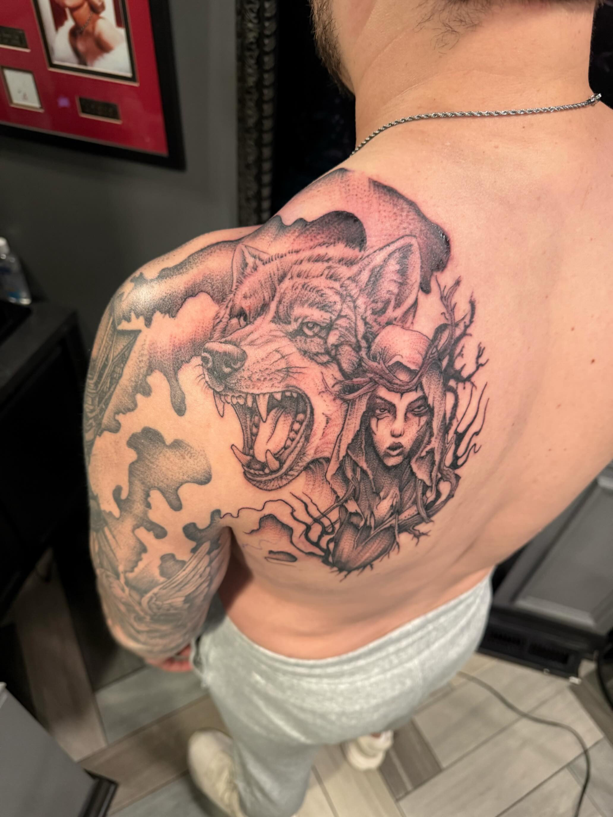 Wolf and woman realism tattoo on the shoulder by Dave Potavin, Erlanger, Kentucky
