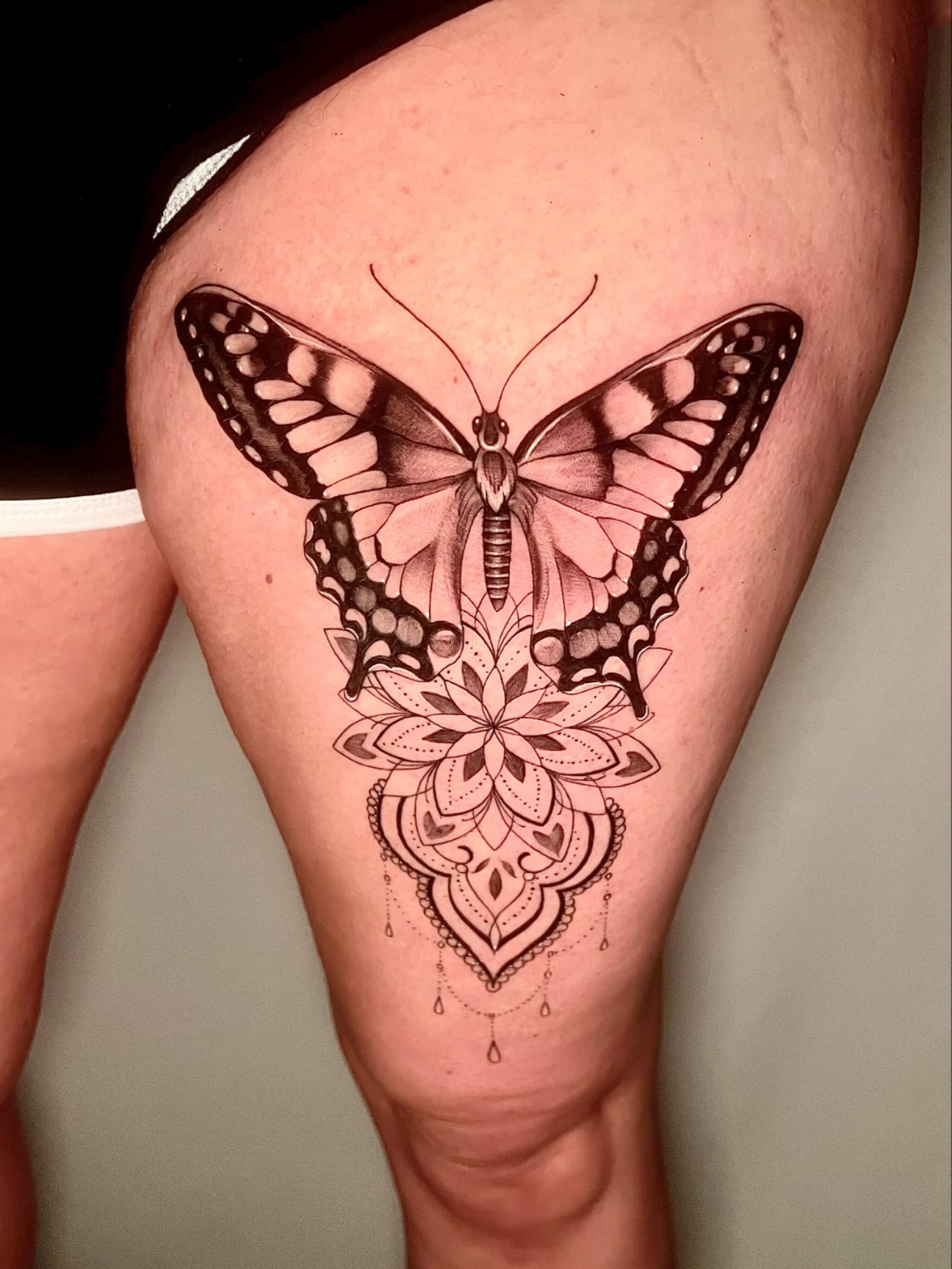 Butterfly and mandala geometric tattoo on the thigh by Joi Bailey, Denton, Texas