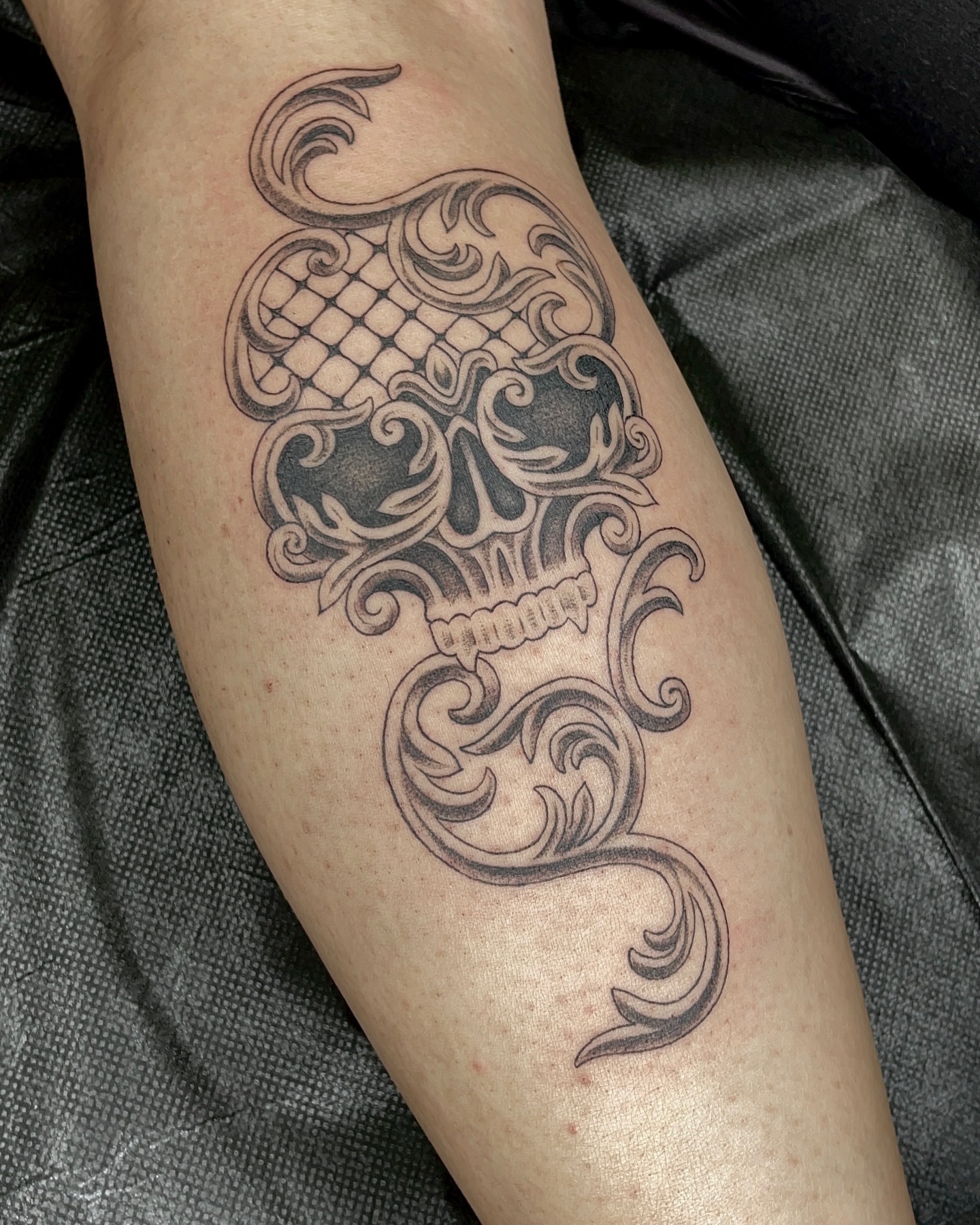 Skull tribal tattoo on the forearm by Tattoo Artist, in San Francisco, CA