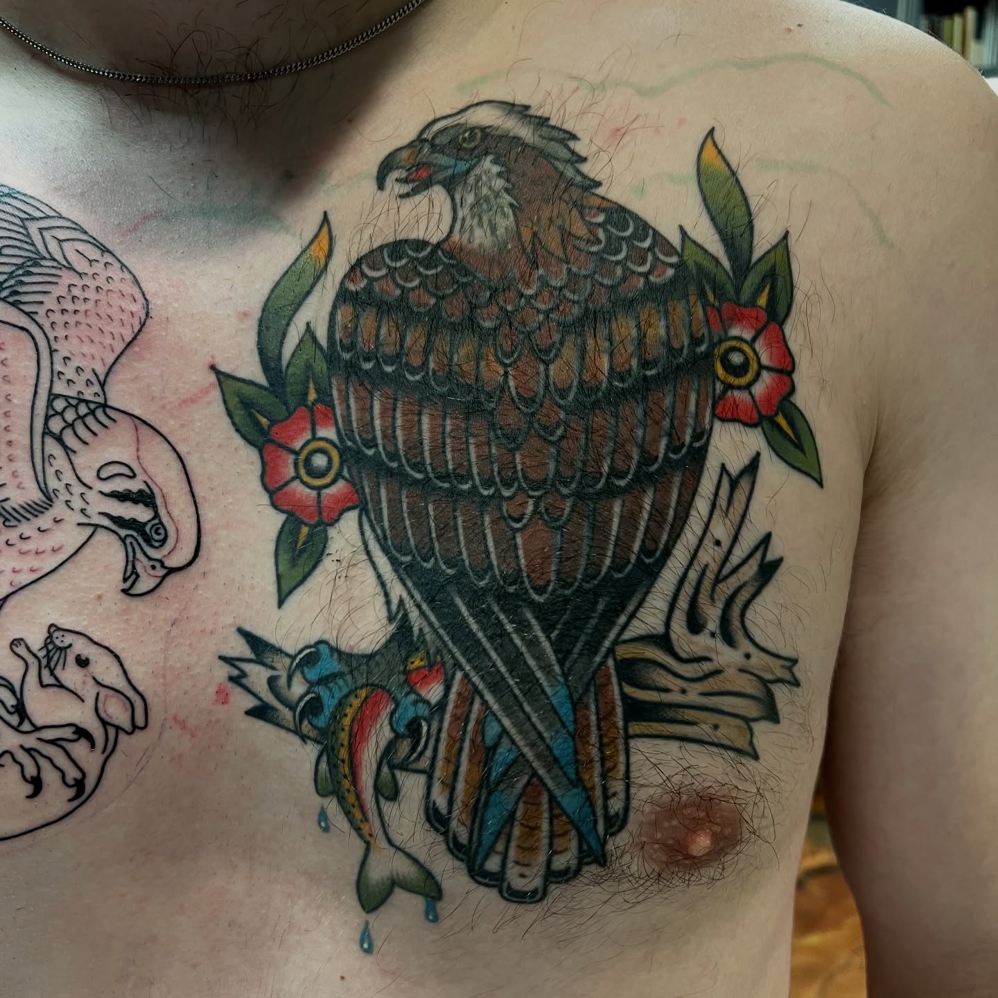 Hawk and flowers American traditional tattoo on the chest by Michael Munter, Philadelphia, Pennsylvania
