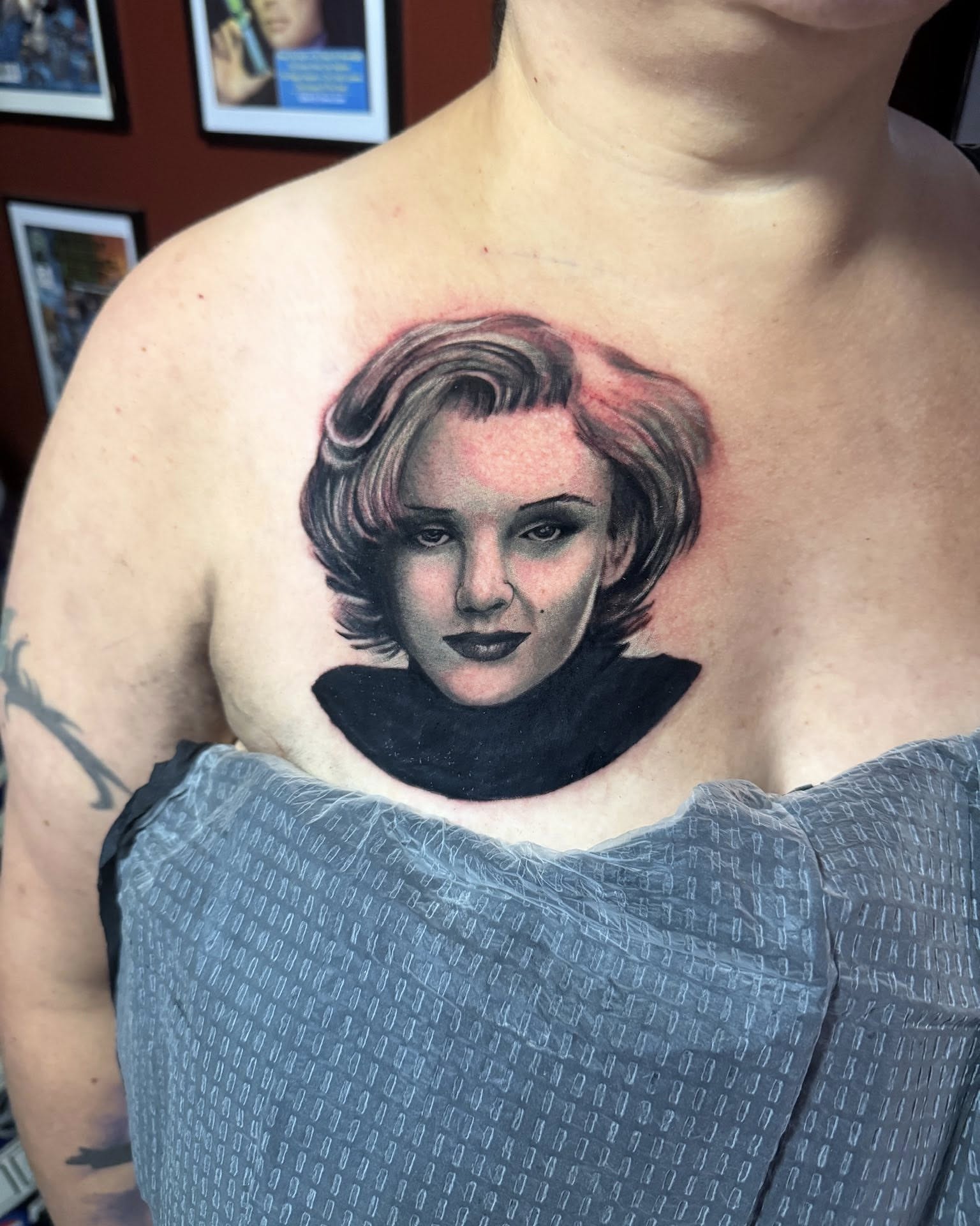 Portrait realism tattoo on the chest by Garrett Rautio