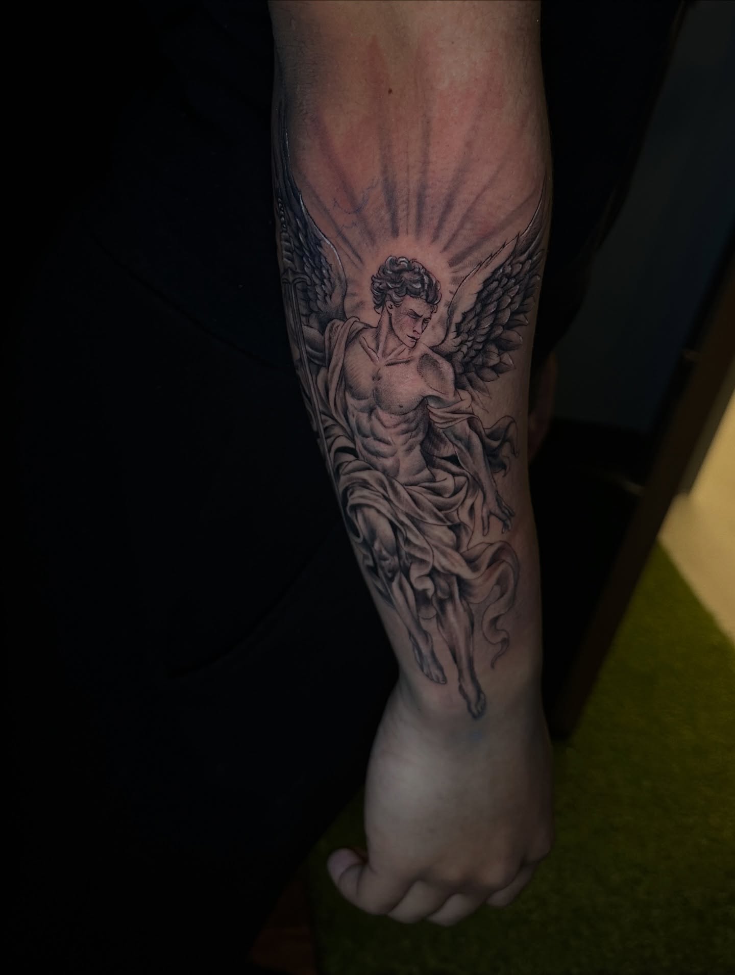 Angel black and grey tattoo on the forearm by Chris (Pikasso)