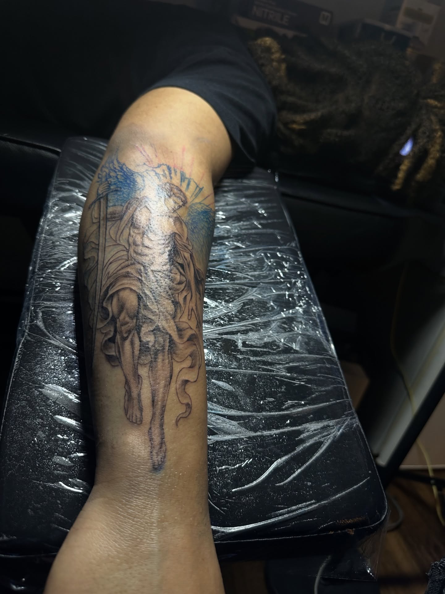 Religious figure black and grey tattoo on the forearm by Chris (Pikasso)
