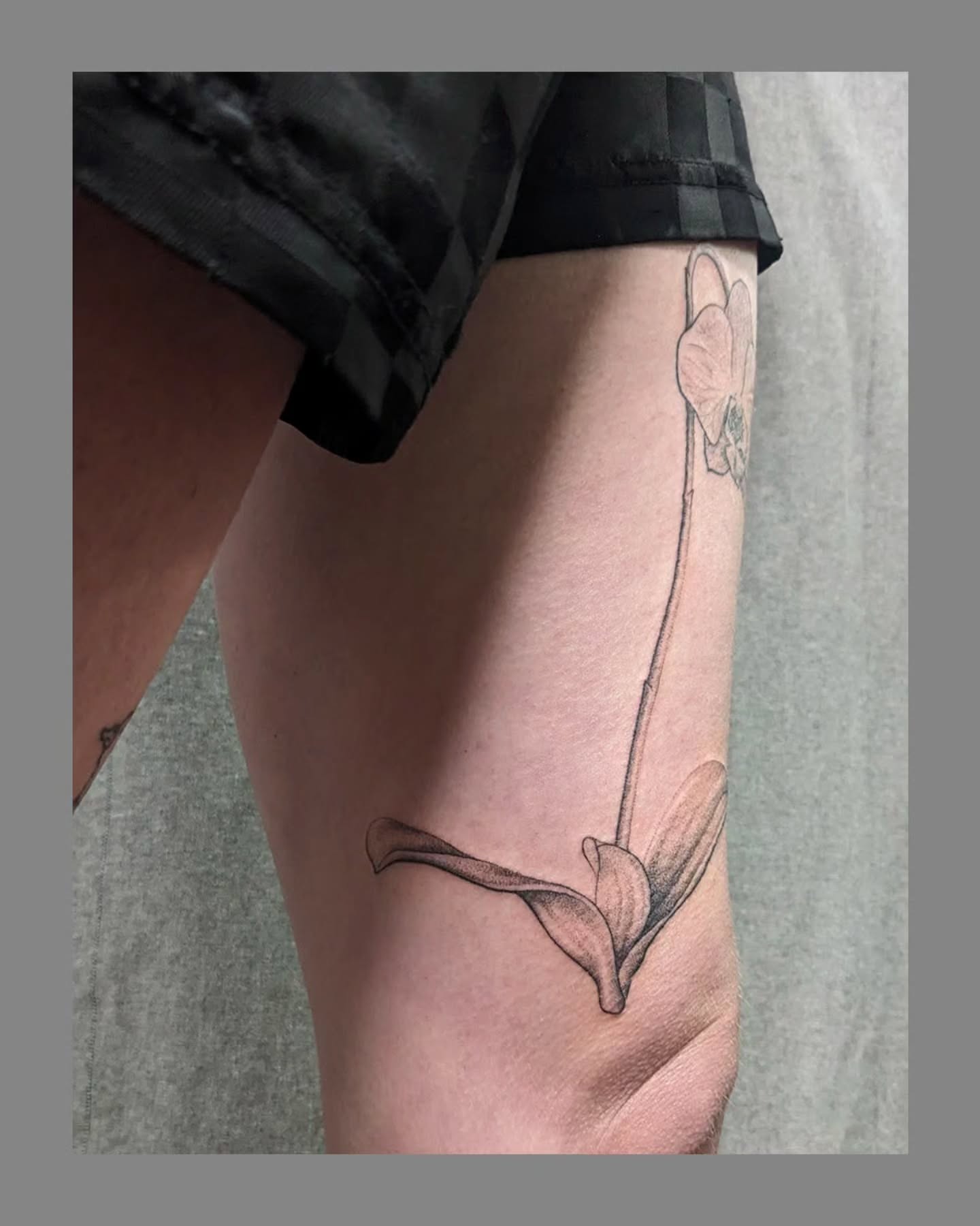 Flower black and grey tattoo on the calf by Marria