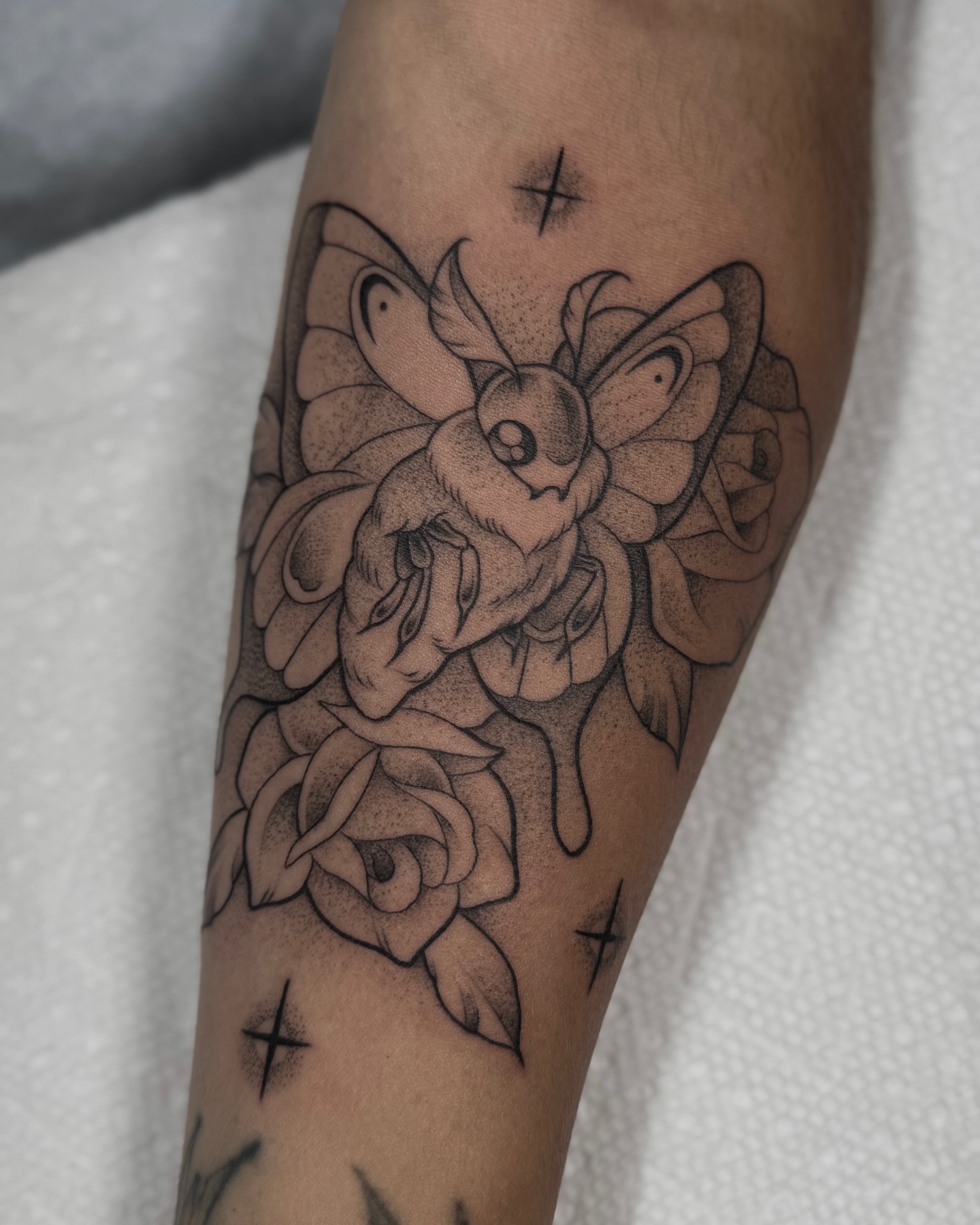 Butterfly and roses dotwork tattoo on the forearm by Ally Ghastly, Eugene, Oregon