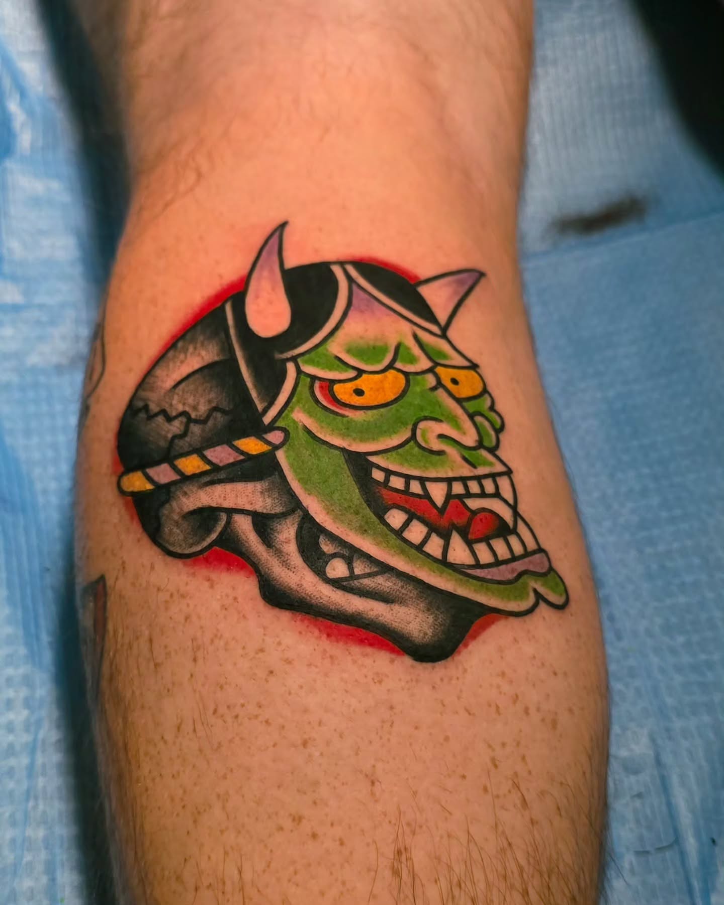 Demon mask American traditional tattoo on the forearm by J. Kirsch New Jersey Tattoo Artist