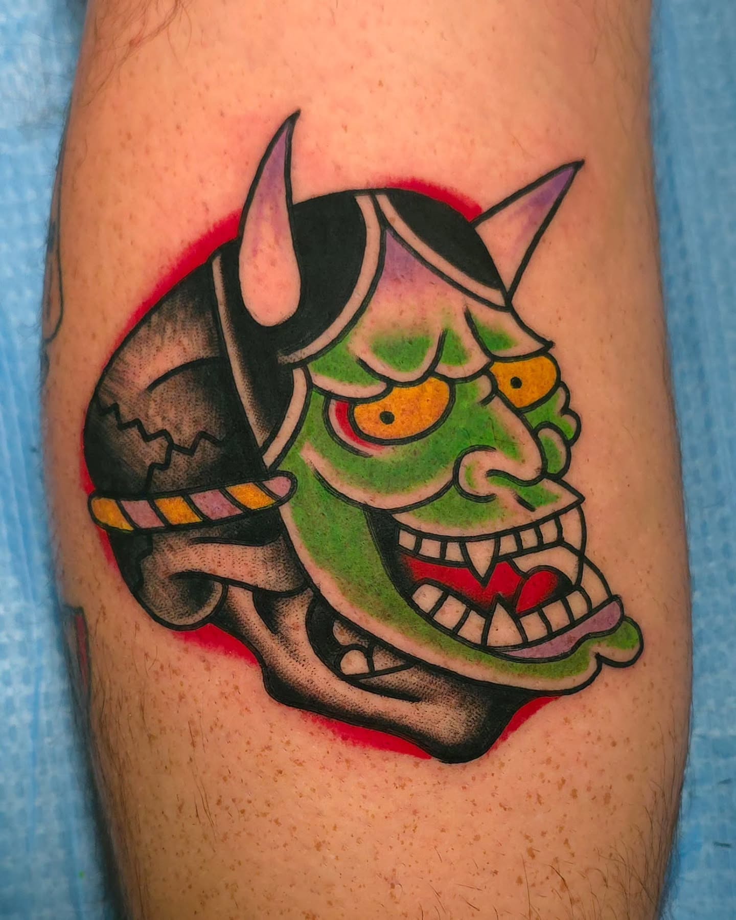 Demon mask American traditional tattoo on the forearm by J. Kirsch New Jersey Tattoo Artist